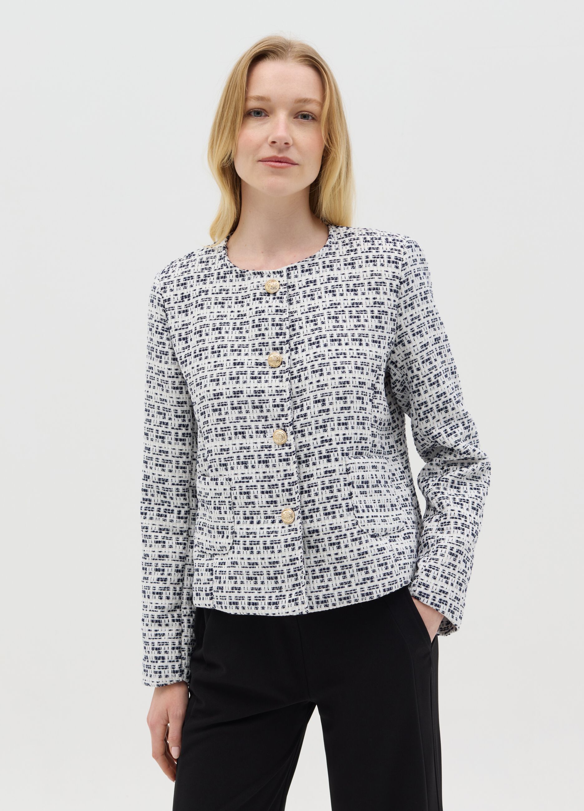 Short black and white jacket in tweed
