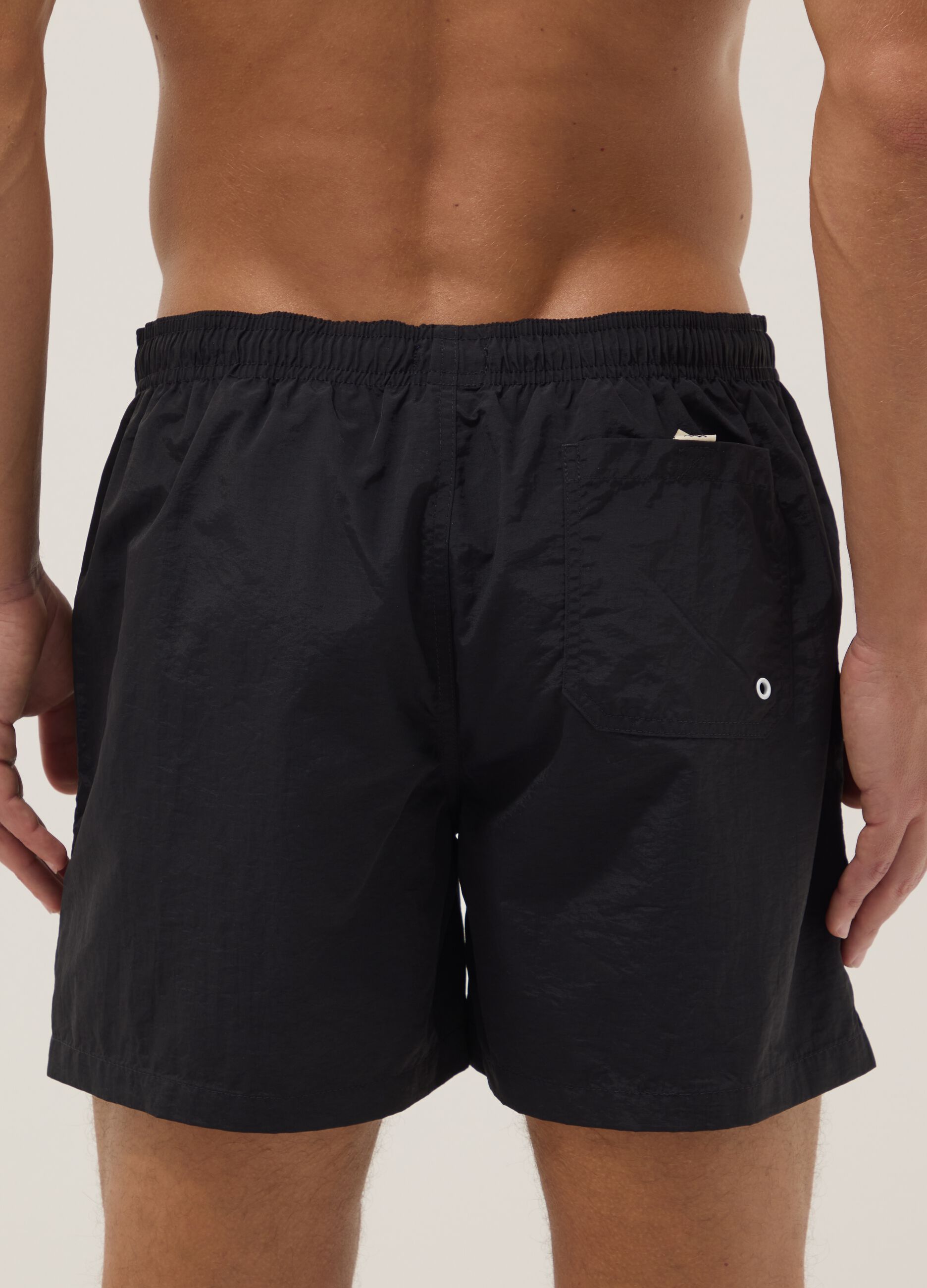 Black regular-fit swim shorts with drawstring