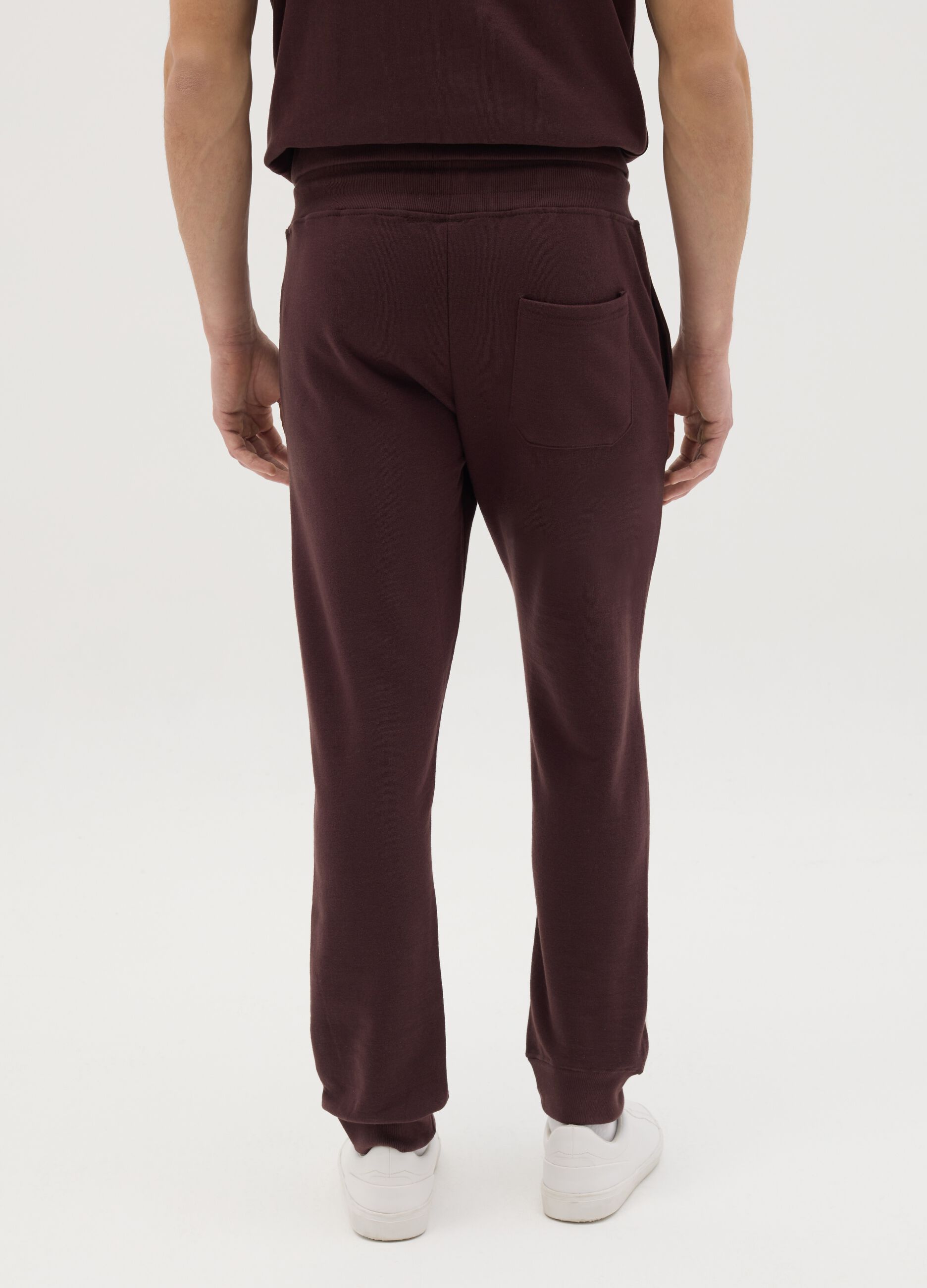 Joggers with contrasting inserts and logo embroidery