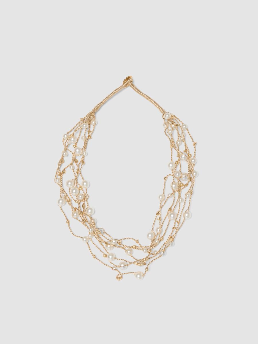Collana beige con perle e fili intrecciati_0