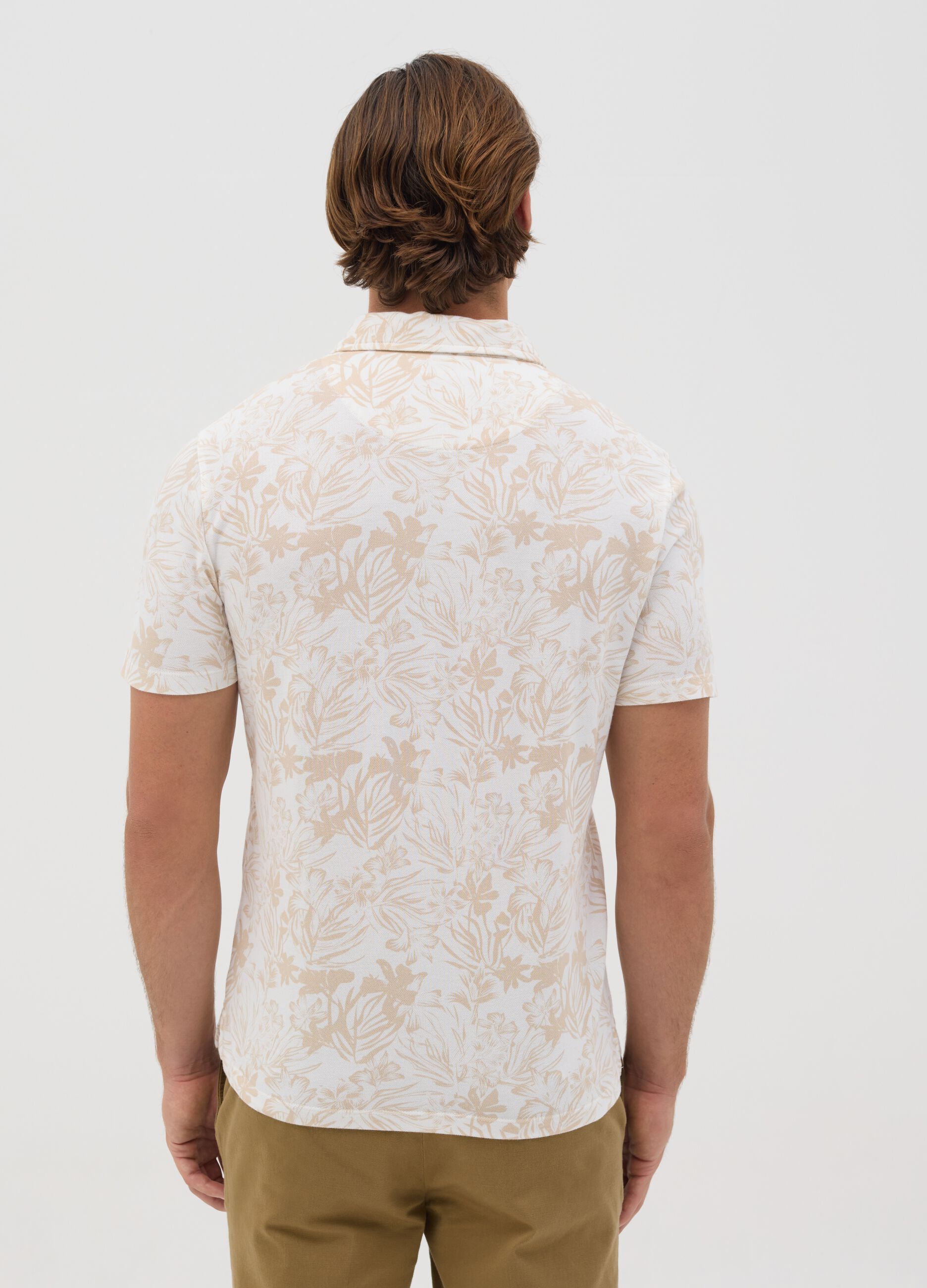 Polo a maniche corte beige con stampa floreale BST