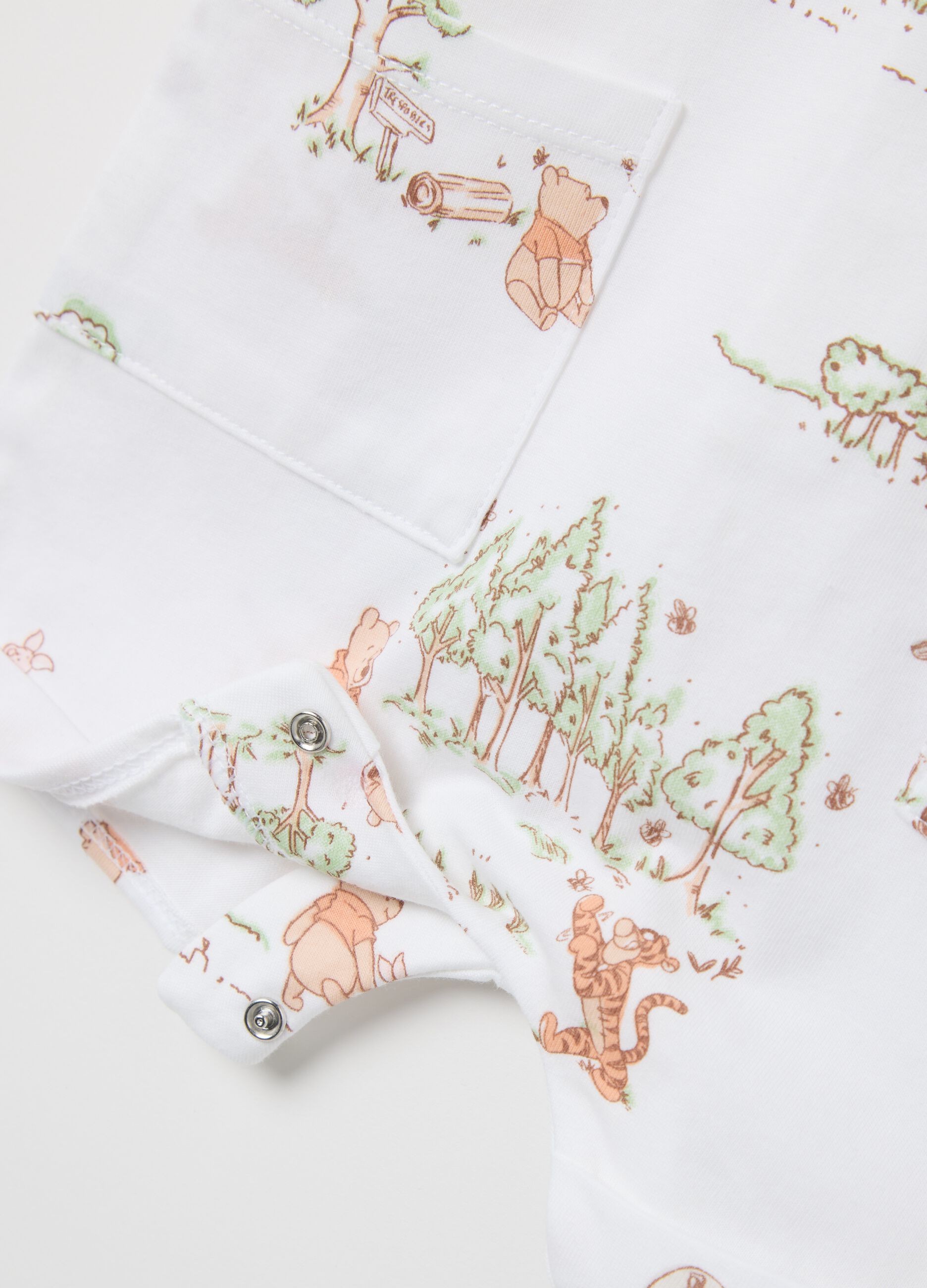 White romper suit in cotton with Winnie the Pooh embroidery and print