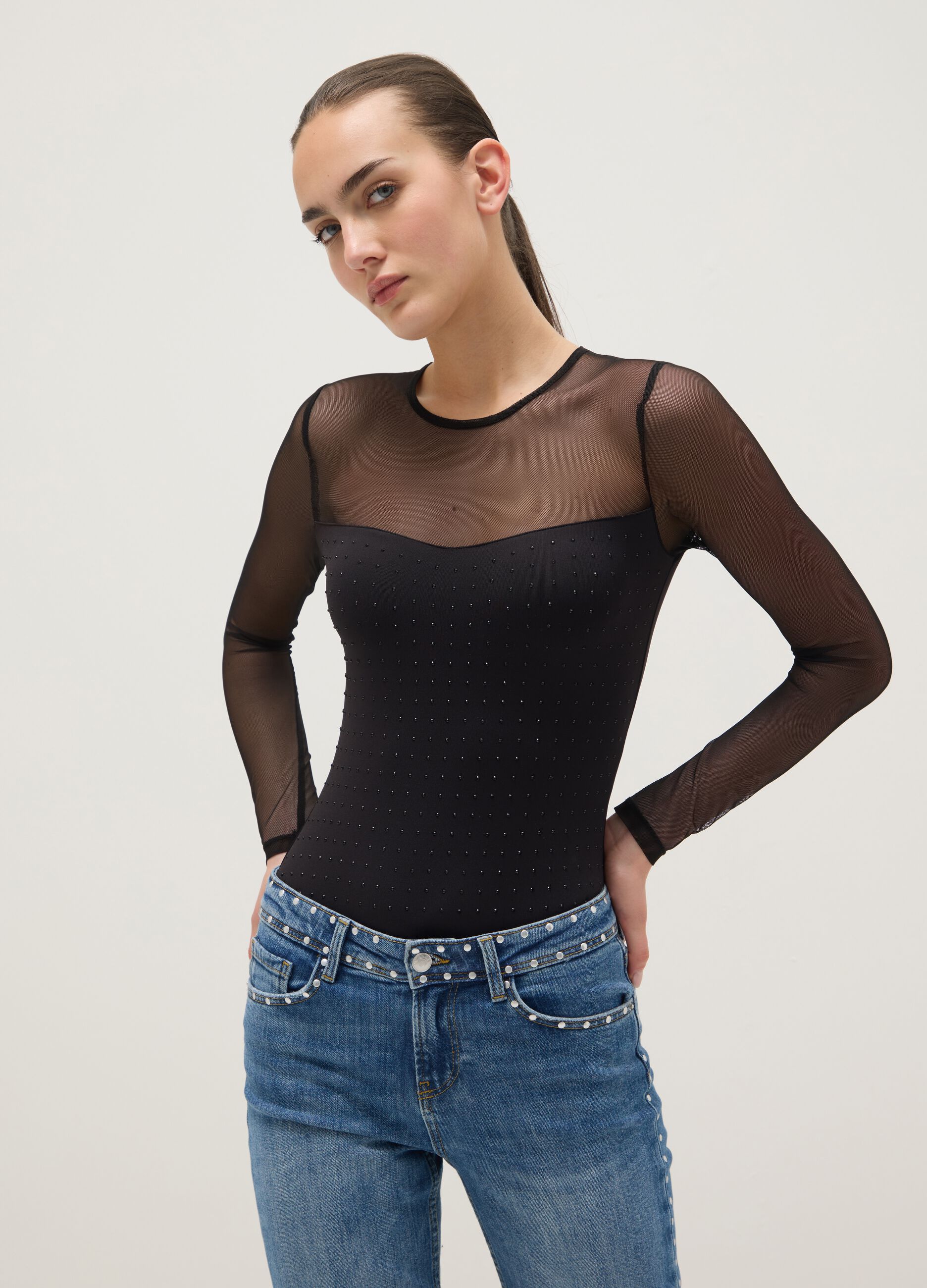 Black slim fit bodysuit with sheer accents