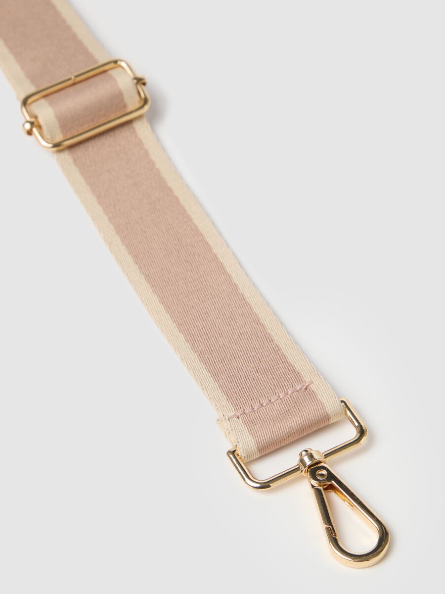 Women's beige shoulder bag with gold accents_1