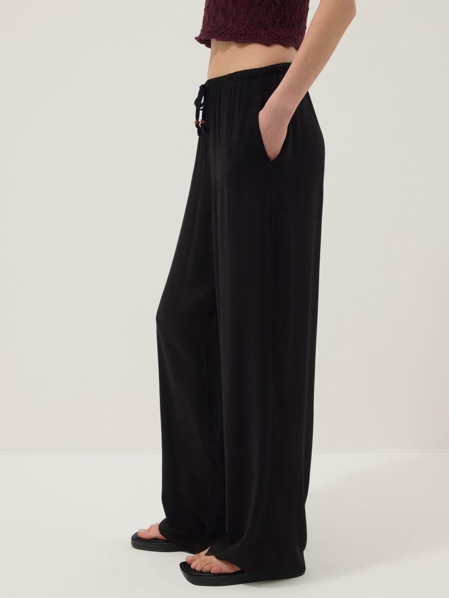 Black palazzo trousers in pure viscose_3