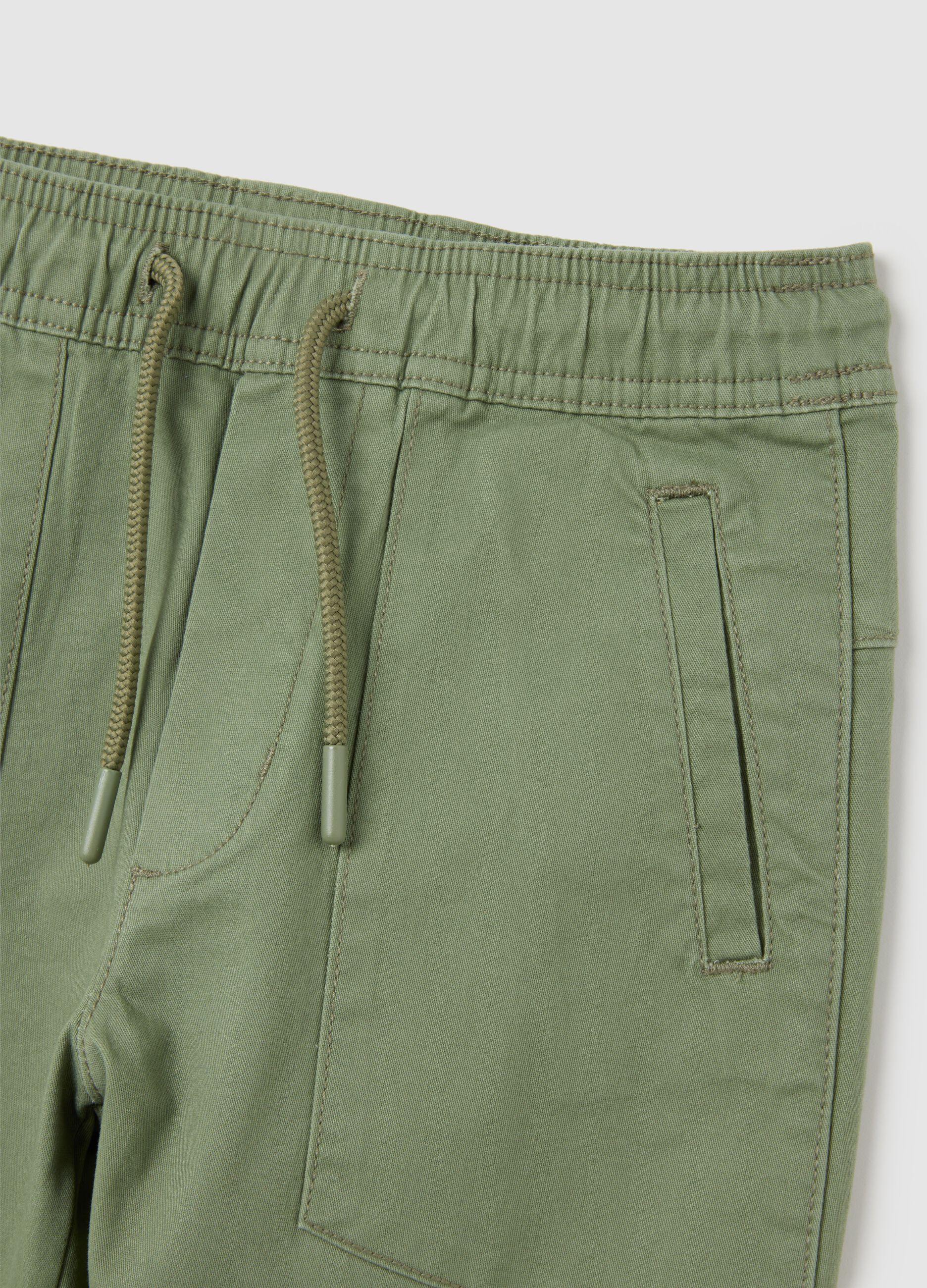 Children's elasticated green cotton trousers