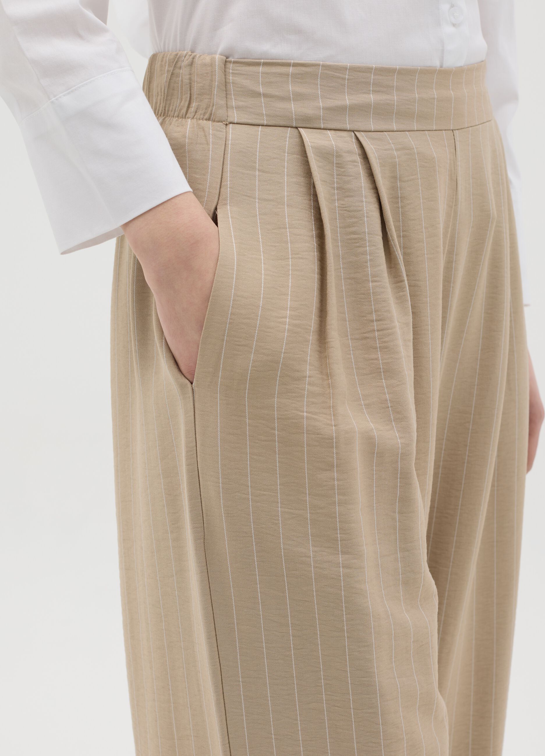 Beige palazzo trousers with striped pattern