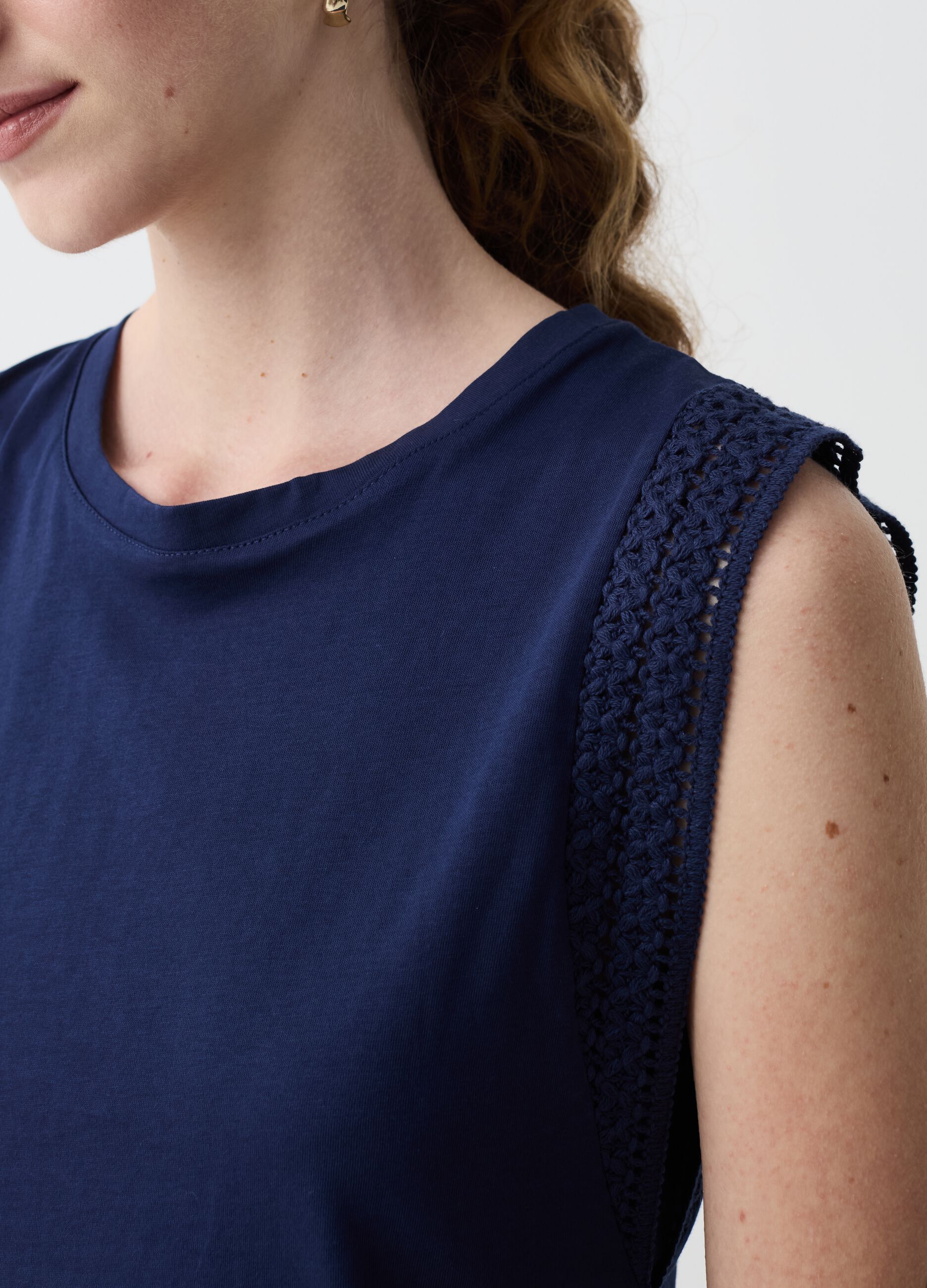Sleeveless top with embroidered trims