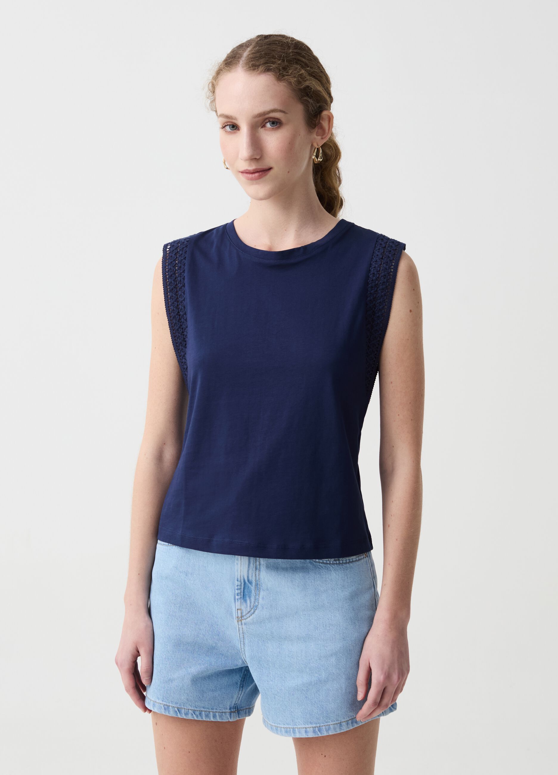 Sleeveless top with embroidered trims