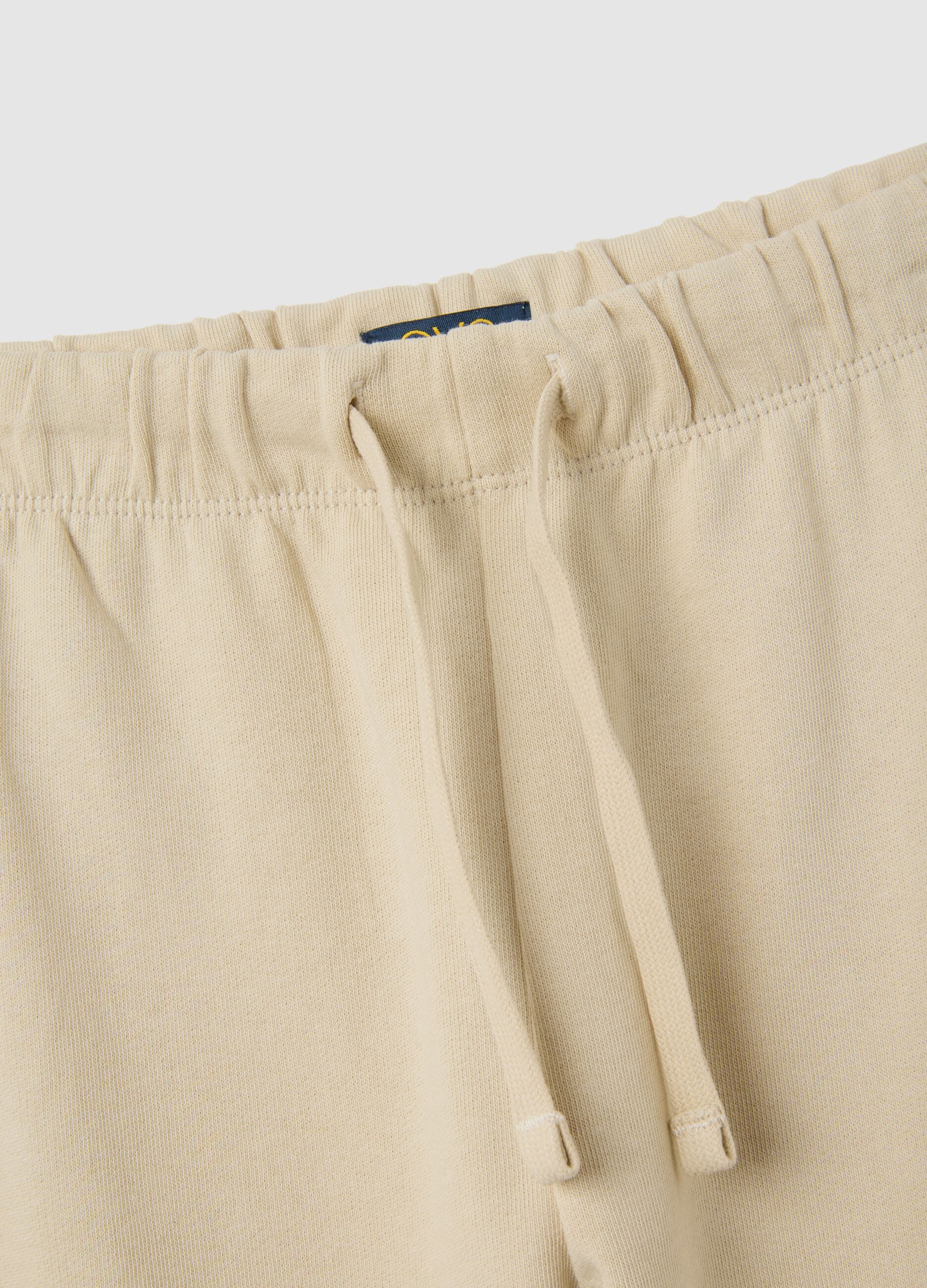 Children's beige regular fit jogger trousers in pure cotton