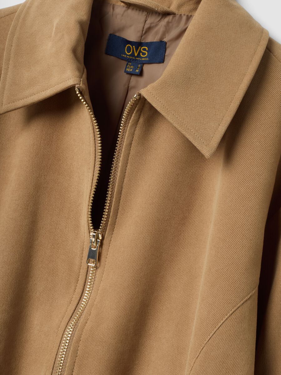 Blazer beige in tessuto elasticizzato con zip over fit_1