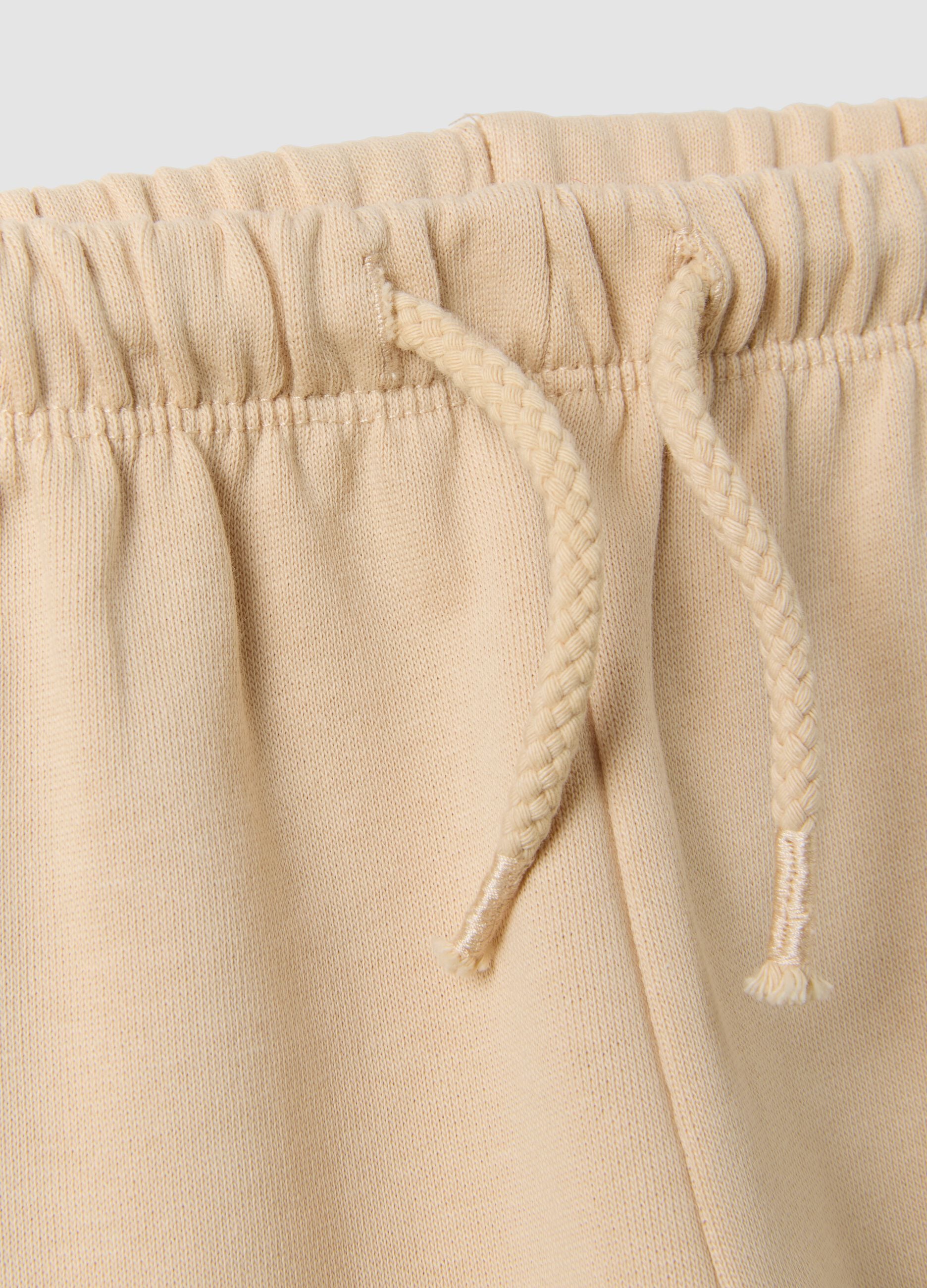 Pantaloni beige in puro cotone con vita elastica e stampa per bimba