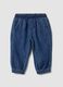 Blue denim trousers in a cotton and viscose blend with elasticated waist_0