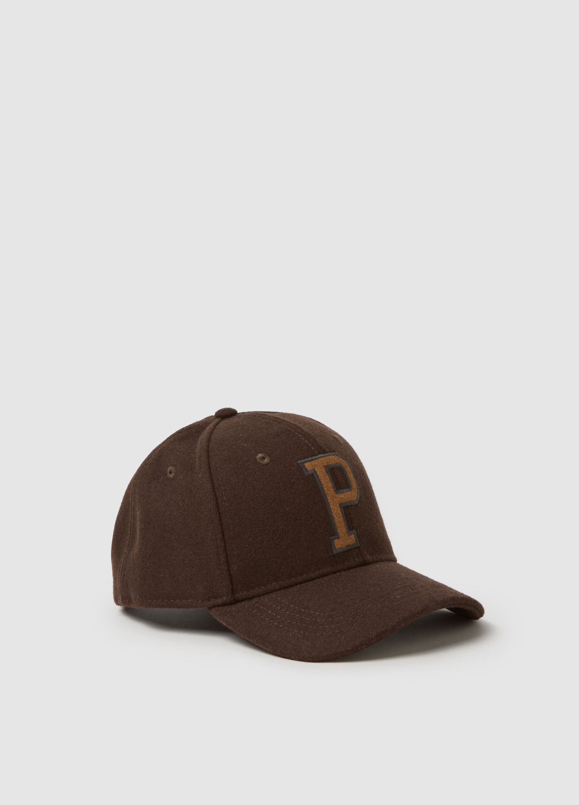 Brown cap with embroidered letter