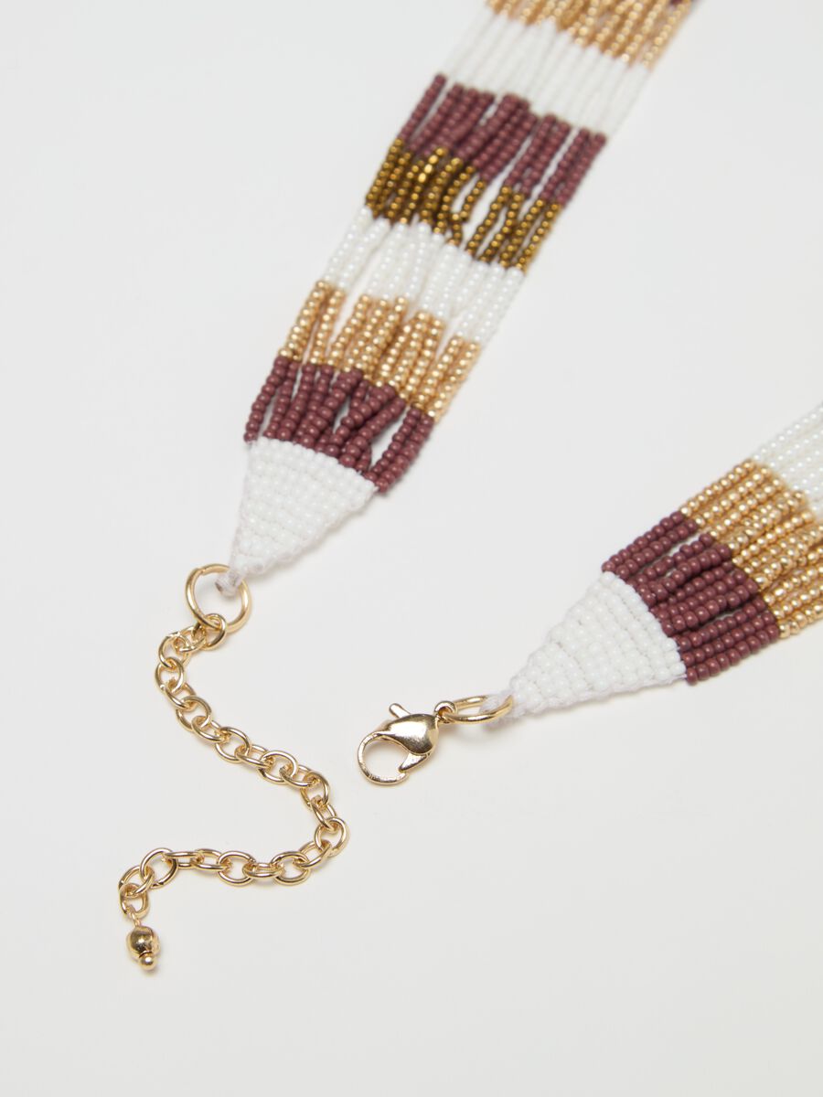 Multi-strand necklace with ethnic detail_1