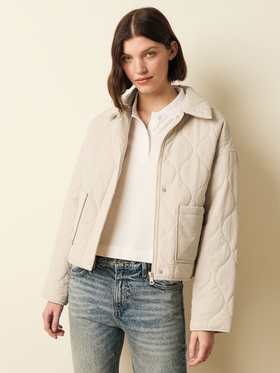 Short quilted jacket with buttons_0