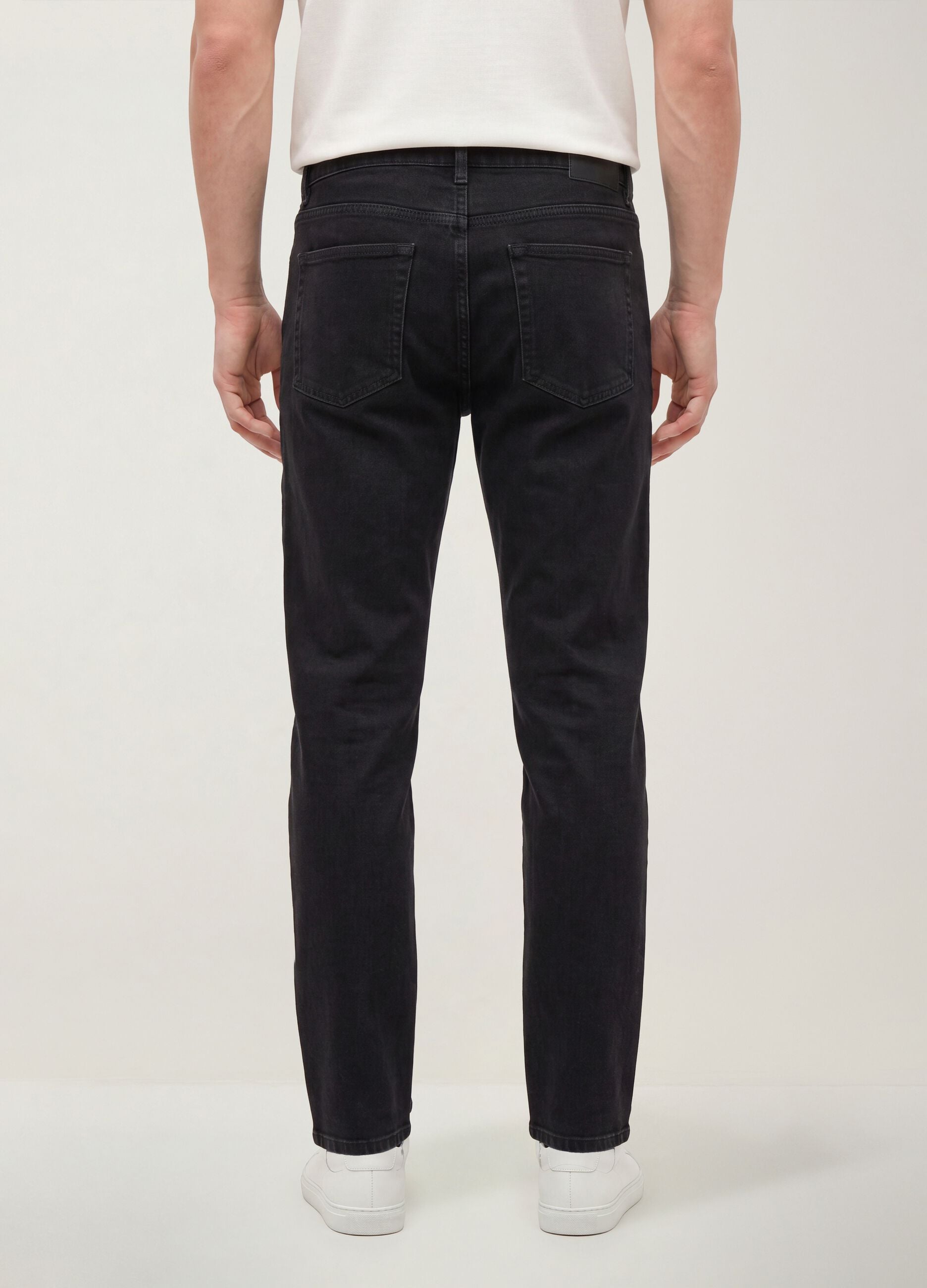 Black regular tapered jeans in a cotton, lyocell and viscose blend