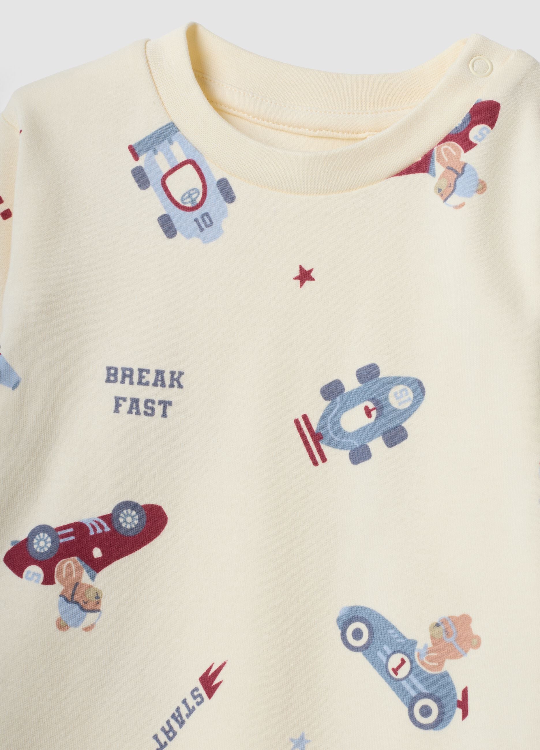 White organic cotton baby pyjamas with car print