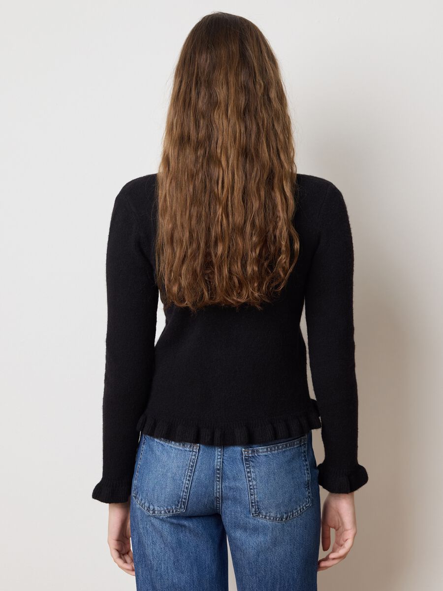 Cardigan nero con volant in misto materiali_3