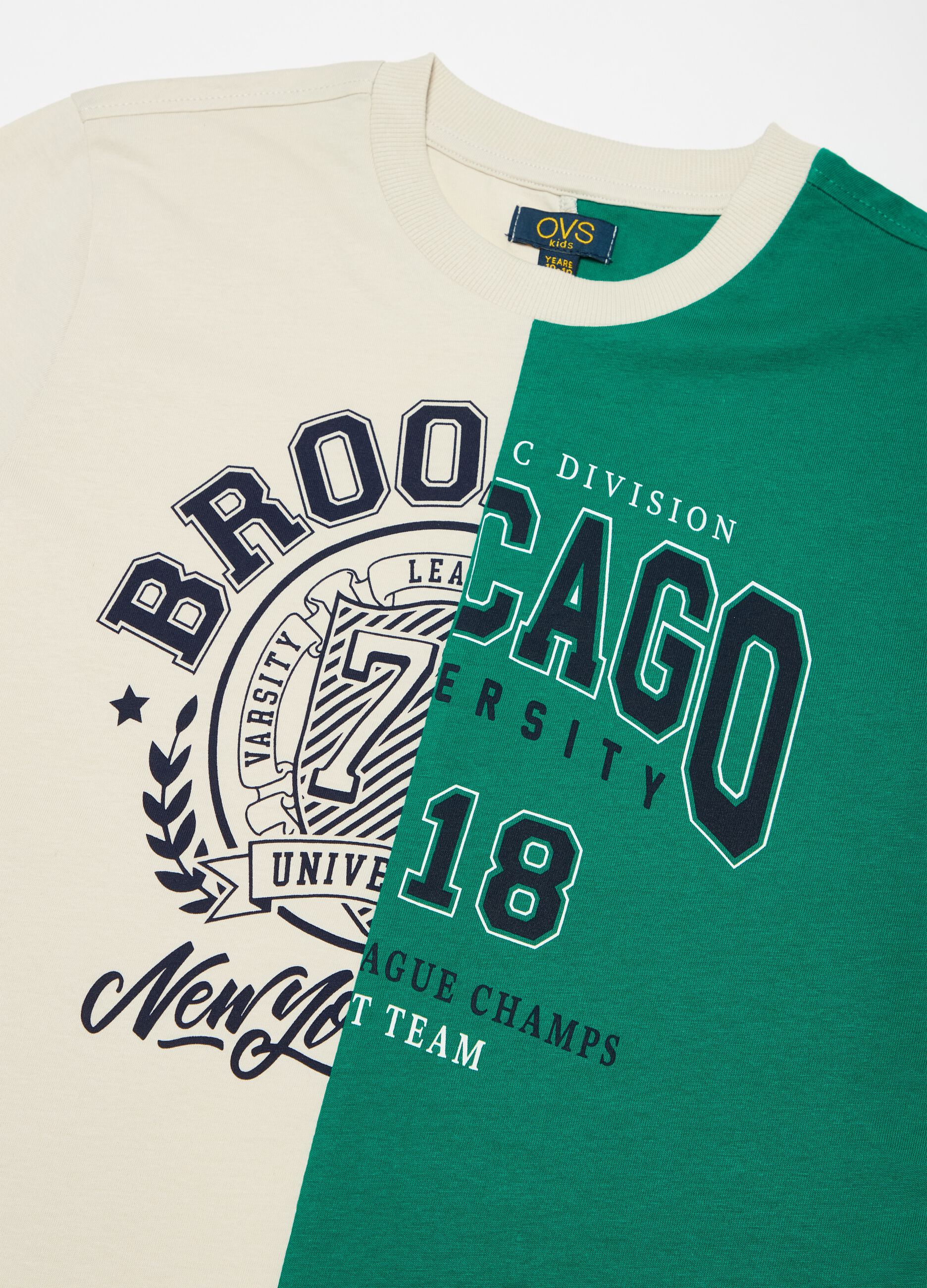 Two-tone T-shirt with printed lettering.