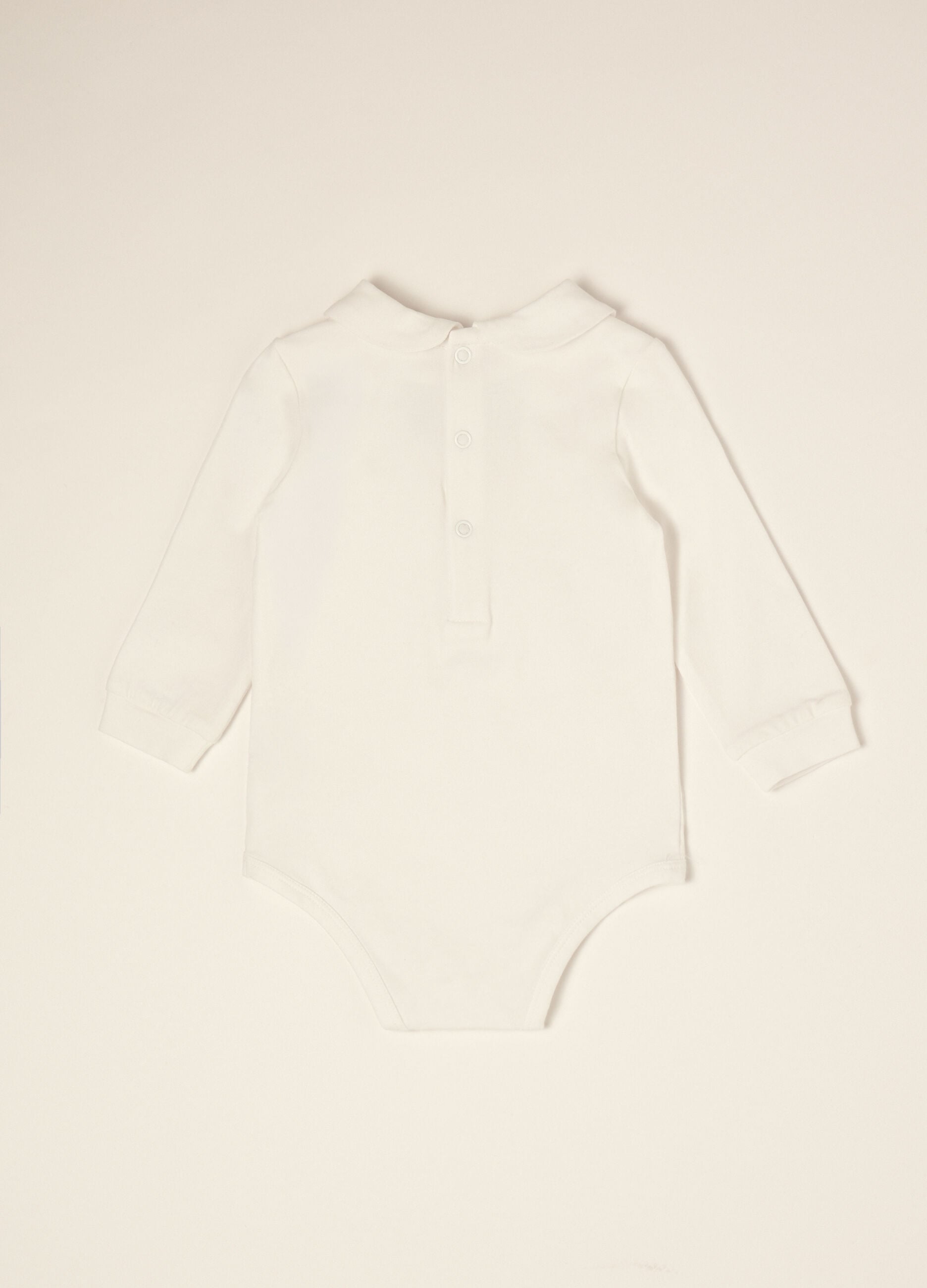 White organic stretch cotton baby bodysuit with bow