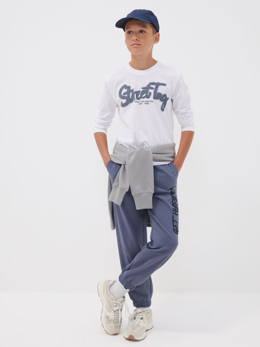 Pantaloni jogger over fit grigia in puro cotone con scritta "Get Hyped" per ragazzo_1