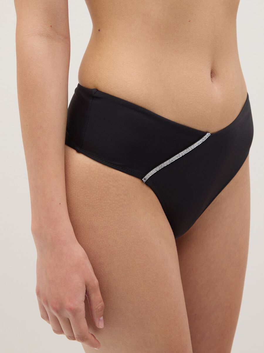 Women’s high-rise bikini briefs in black stretch fabric with diamanté details_3