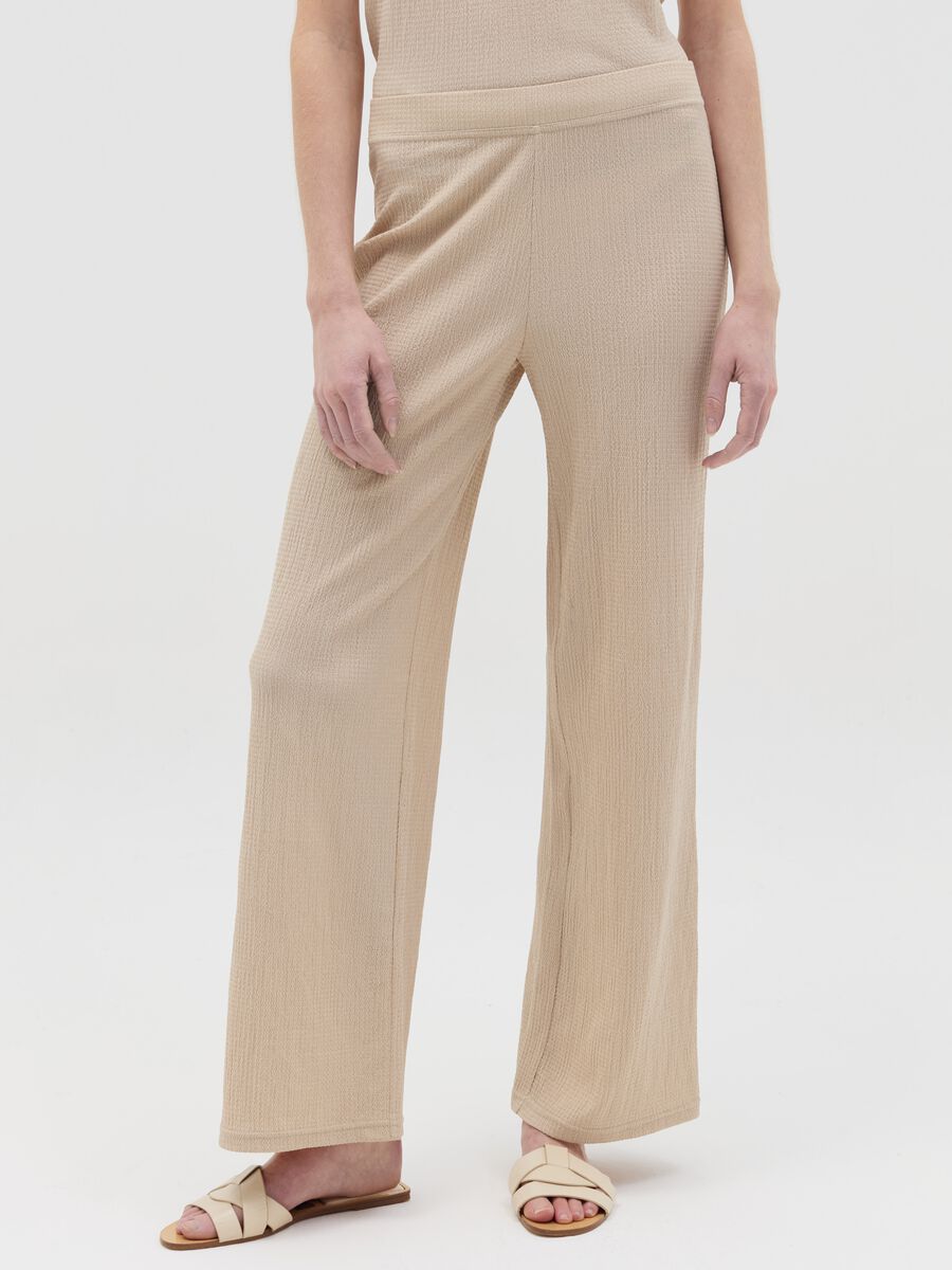 Wide-leg beige trousers with waffle weave_1