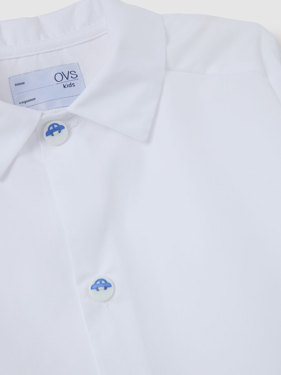 Children's school smock in white cotton blend with buttons_2