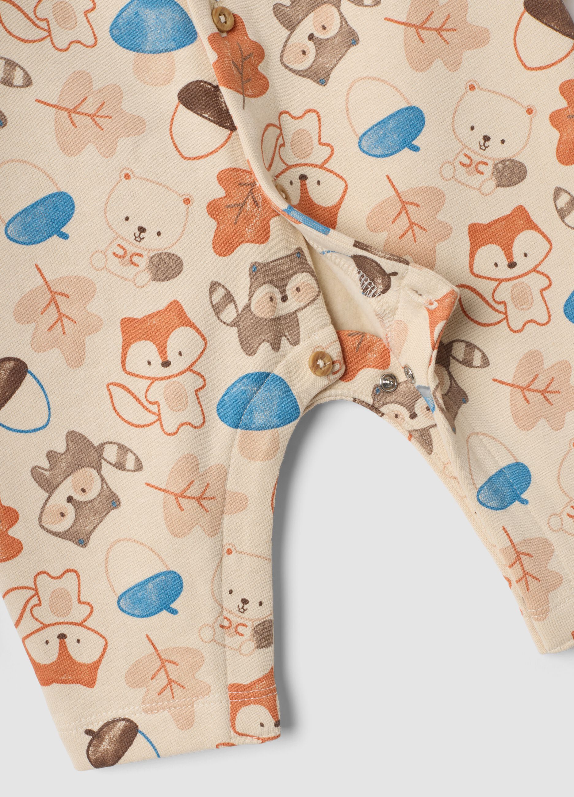 Tutina beige in puro cotone organico con stampa animali