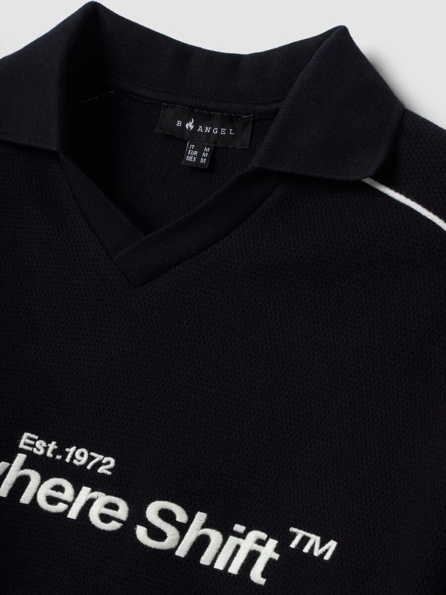 Polo nera in puro cotone over fit a maniche corte over fit_5