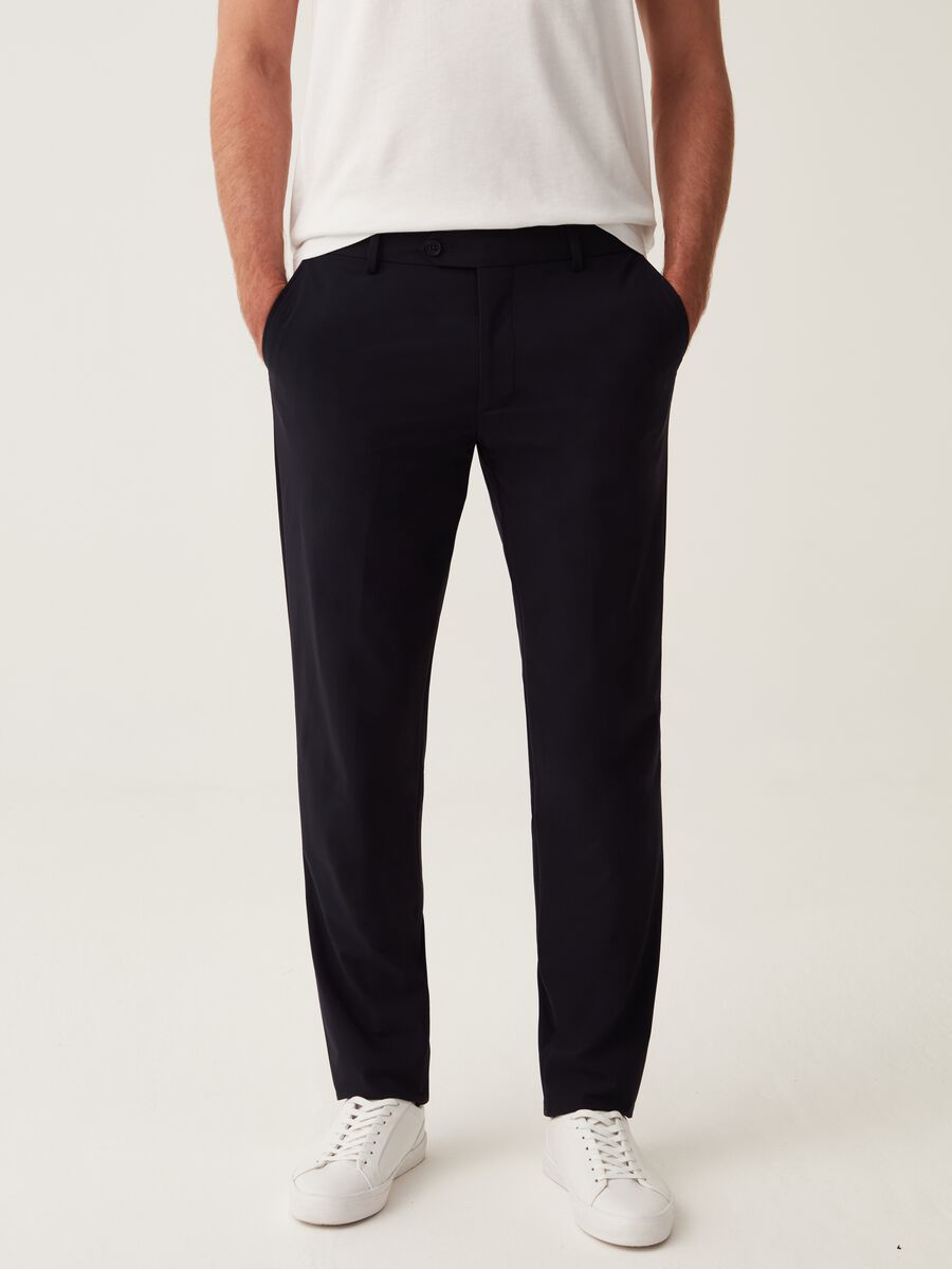 Slim-fit trousers in navy blue technical fabric_1