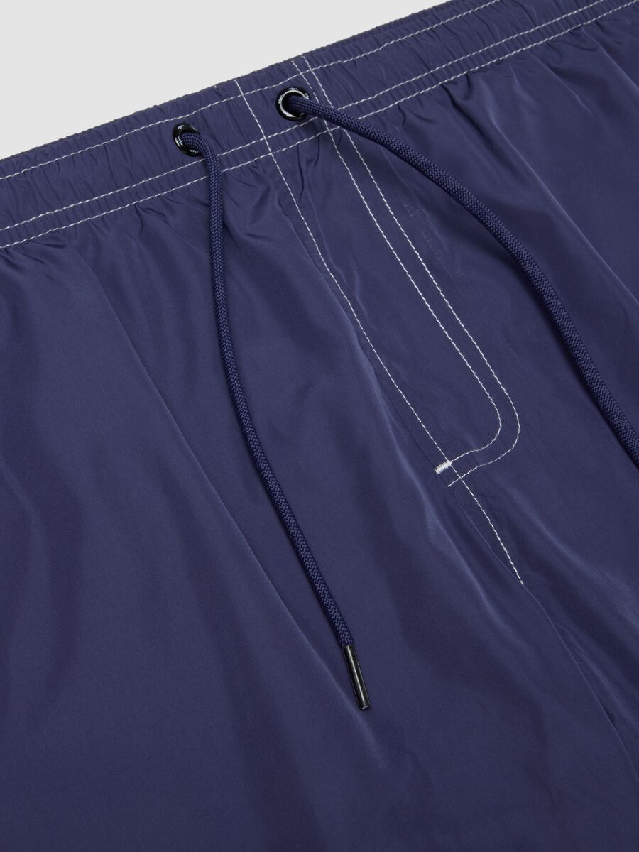 Blue swim shorts with drawstring waist_5