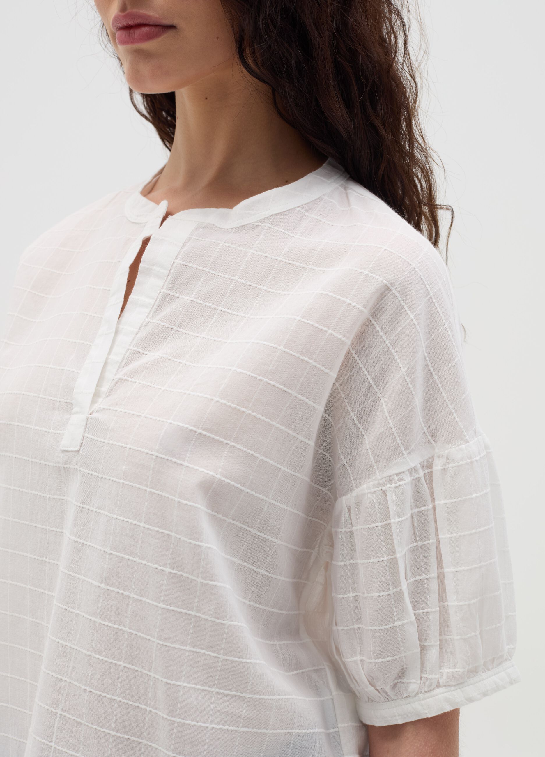 Blouse with raised stitching