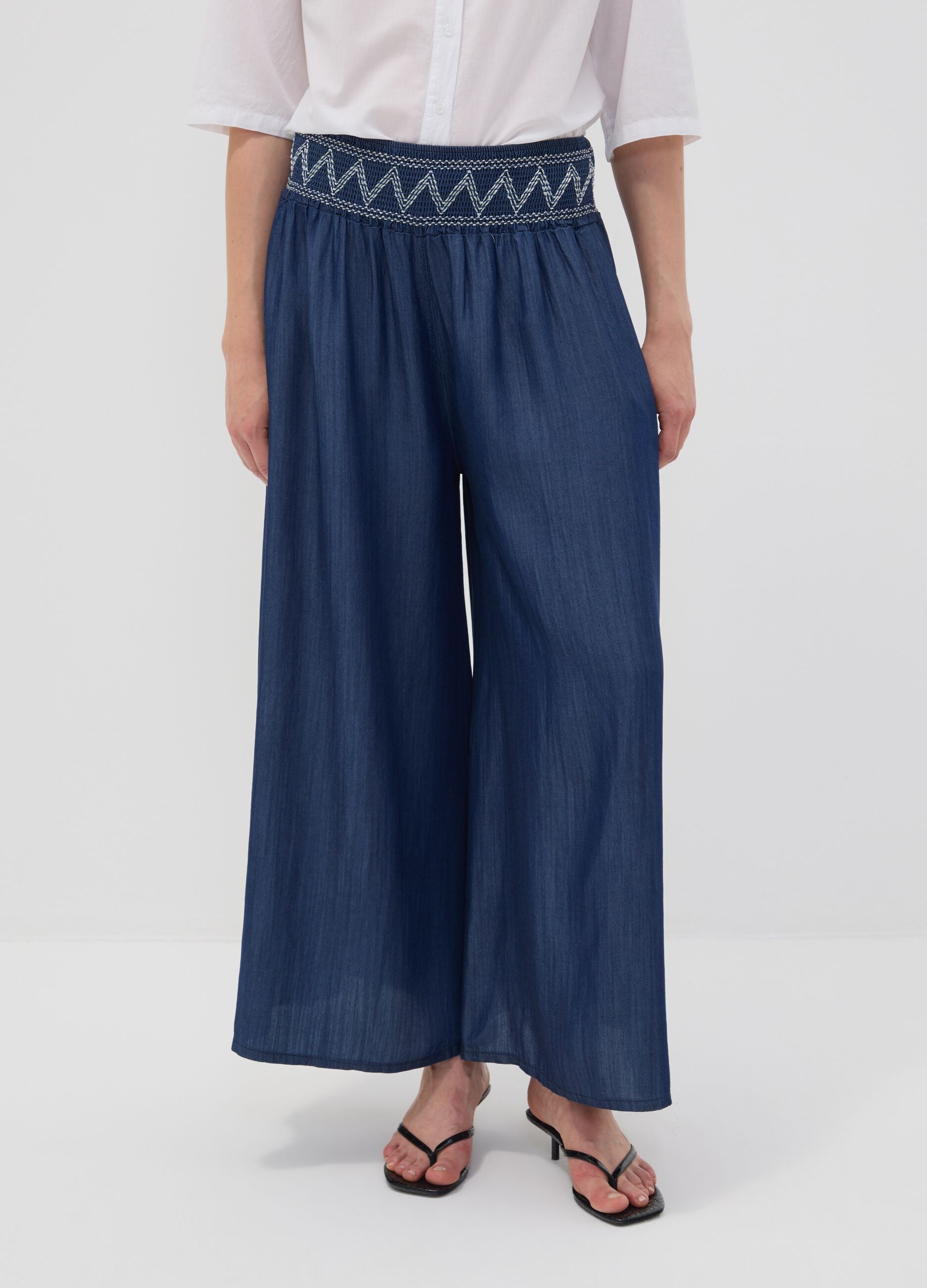 Wide-leg blue formal trousers in pure lyocell with embroidered waistband