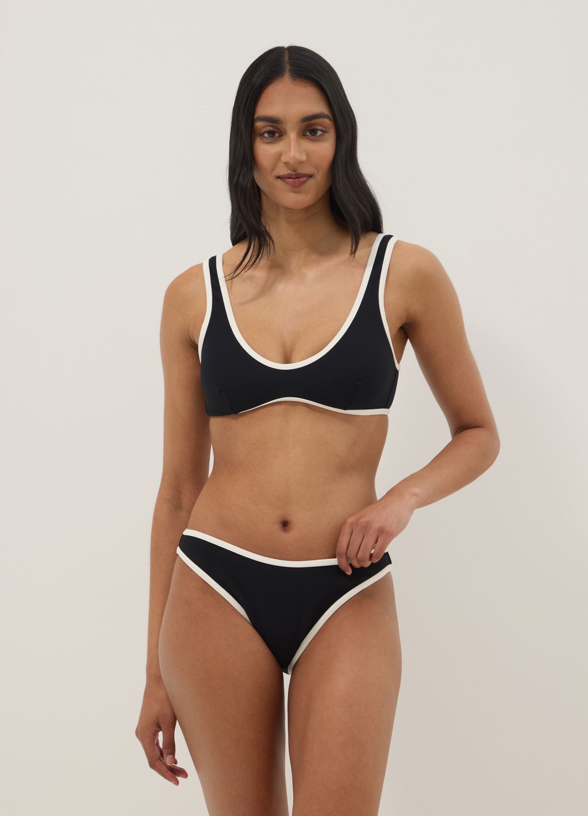 Black stretch fabric bikini top with white trim