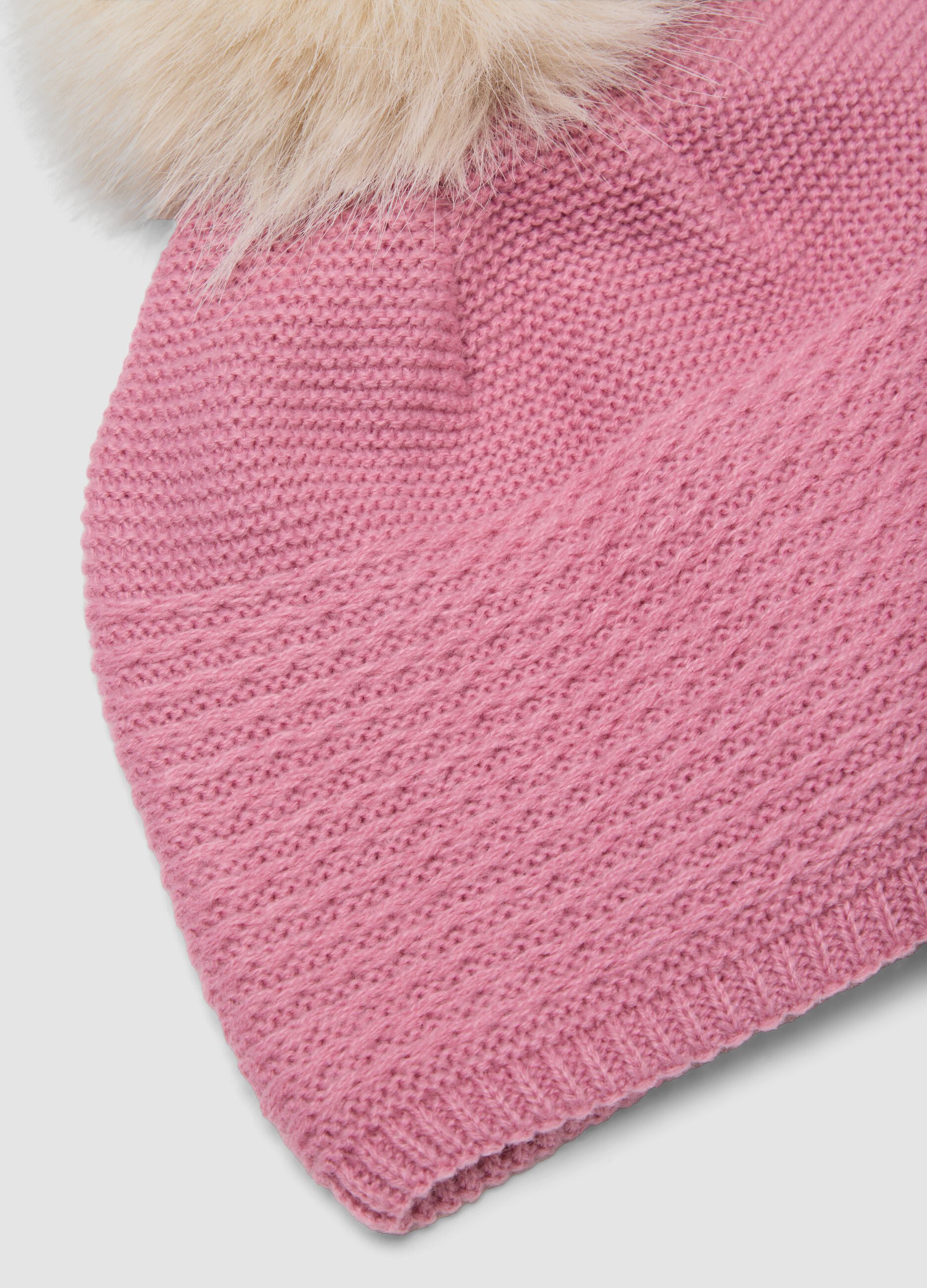 Pink knitted hat with pompom