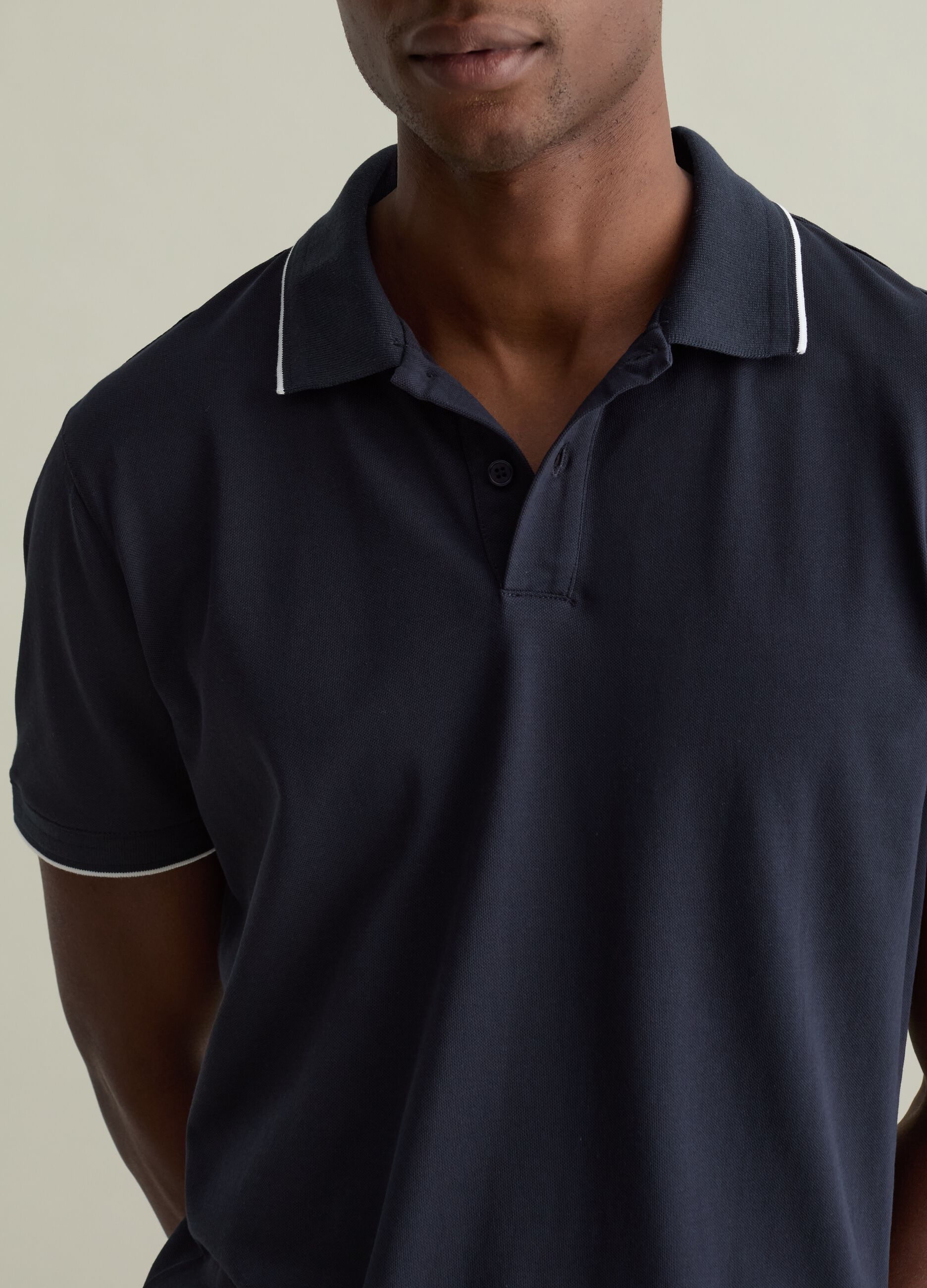 Polo shirt in technical fabric with contrasting edging