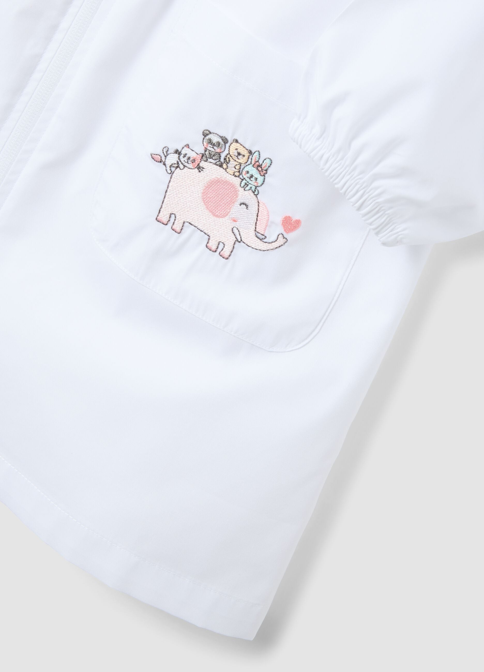 White nursery apron with cute animal embroidery for girls