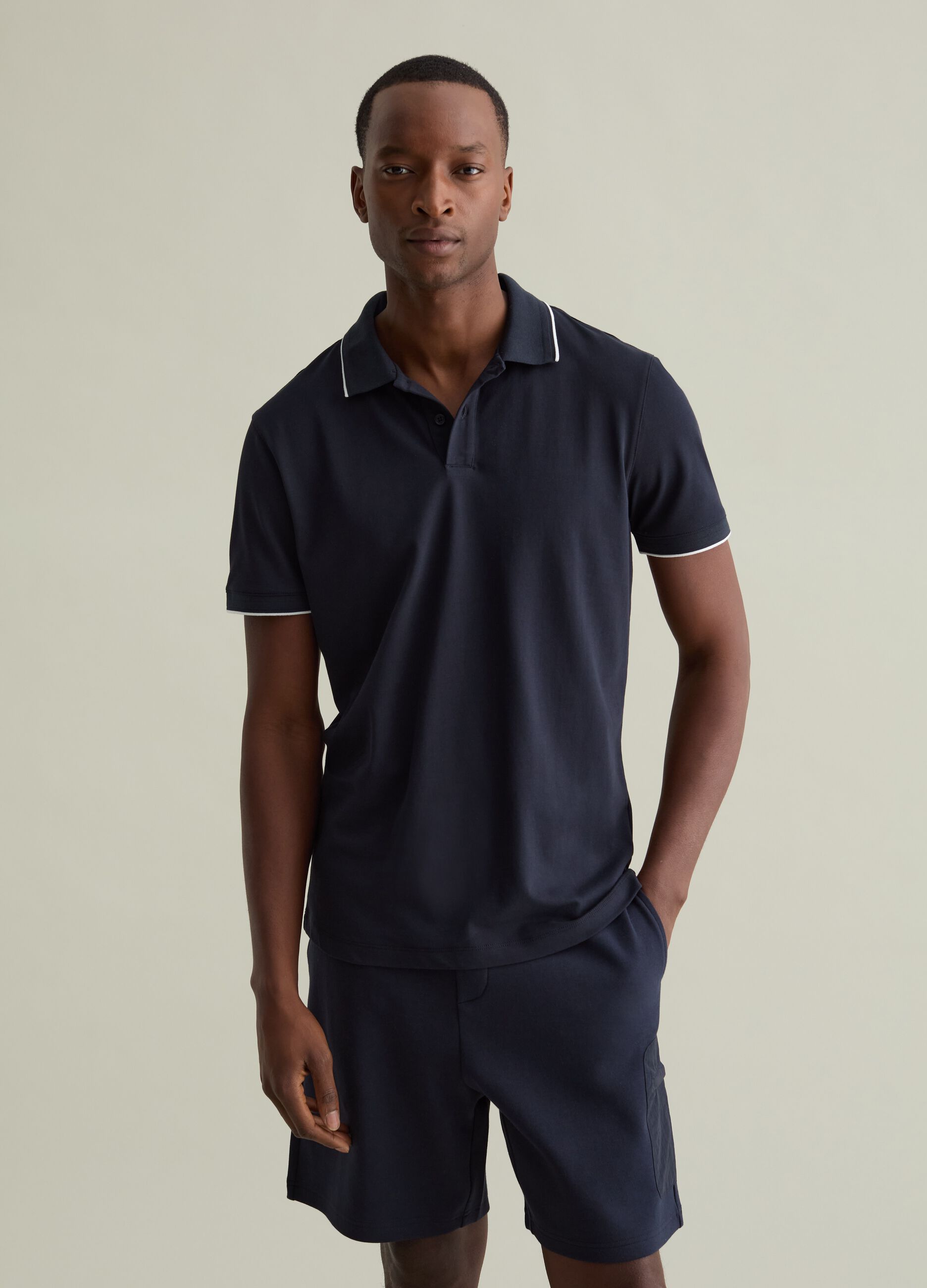 Polo shirt in technical fabric with contrasting edging