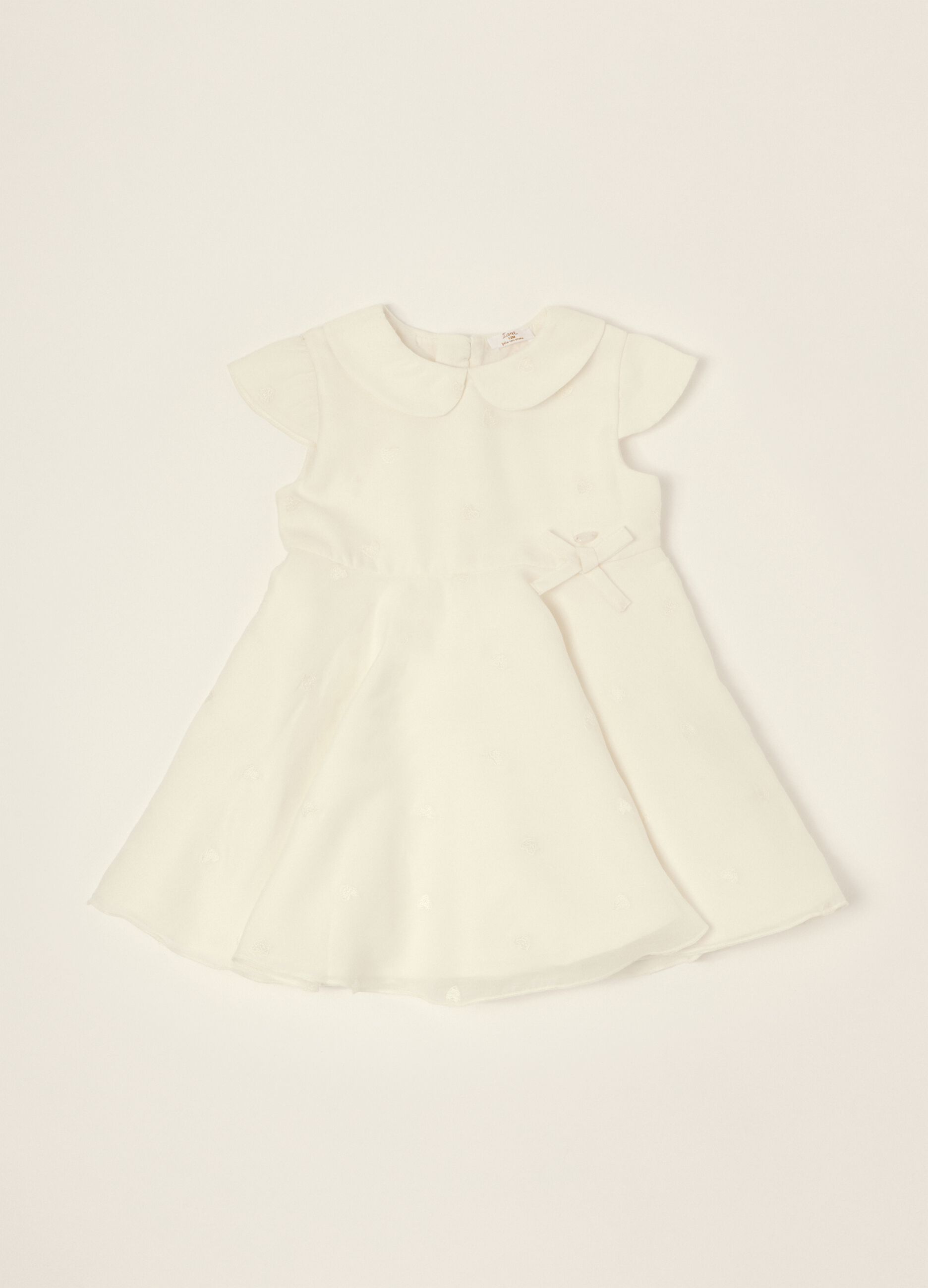 White dress with embroidered details