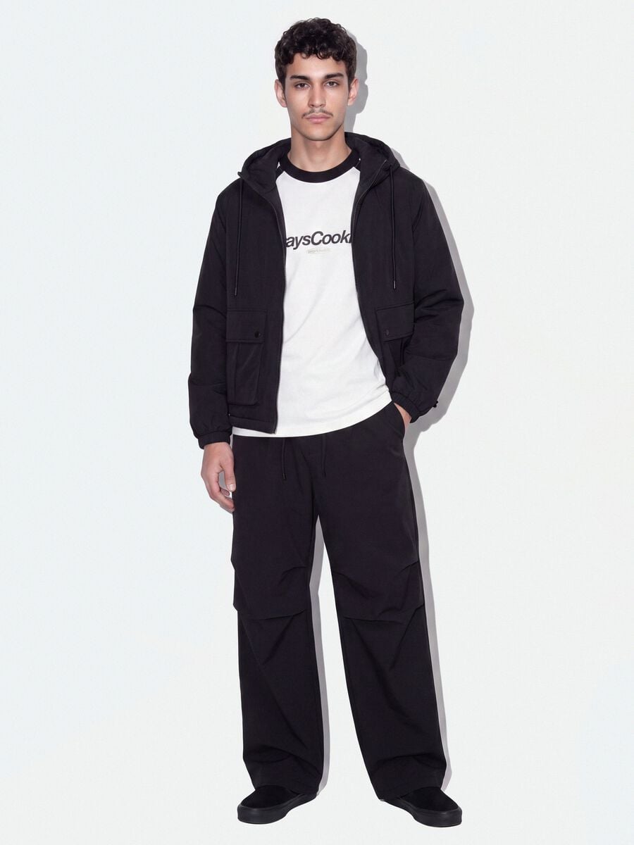 Pantaloni neri in tessuto elasticizzato parachute fit_0