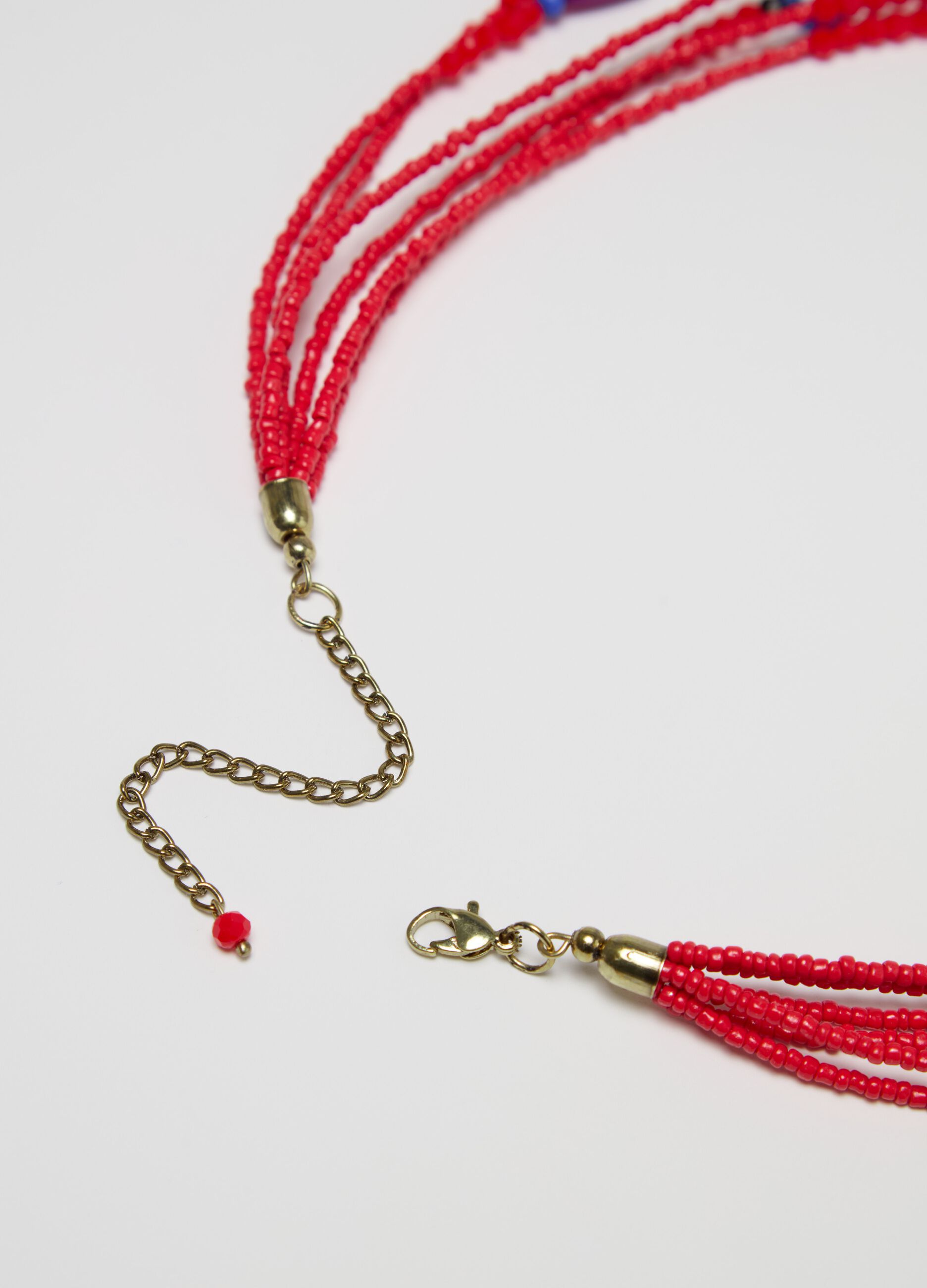 Collana multifili con perline e nappina
