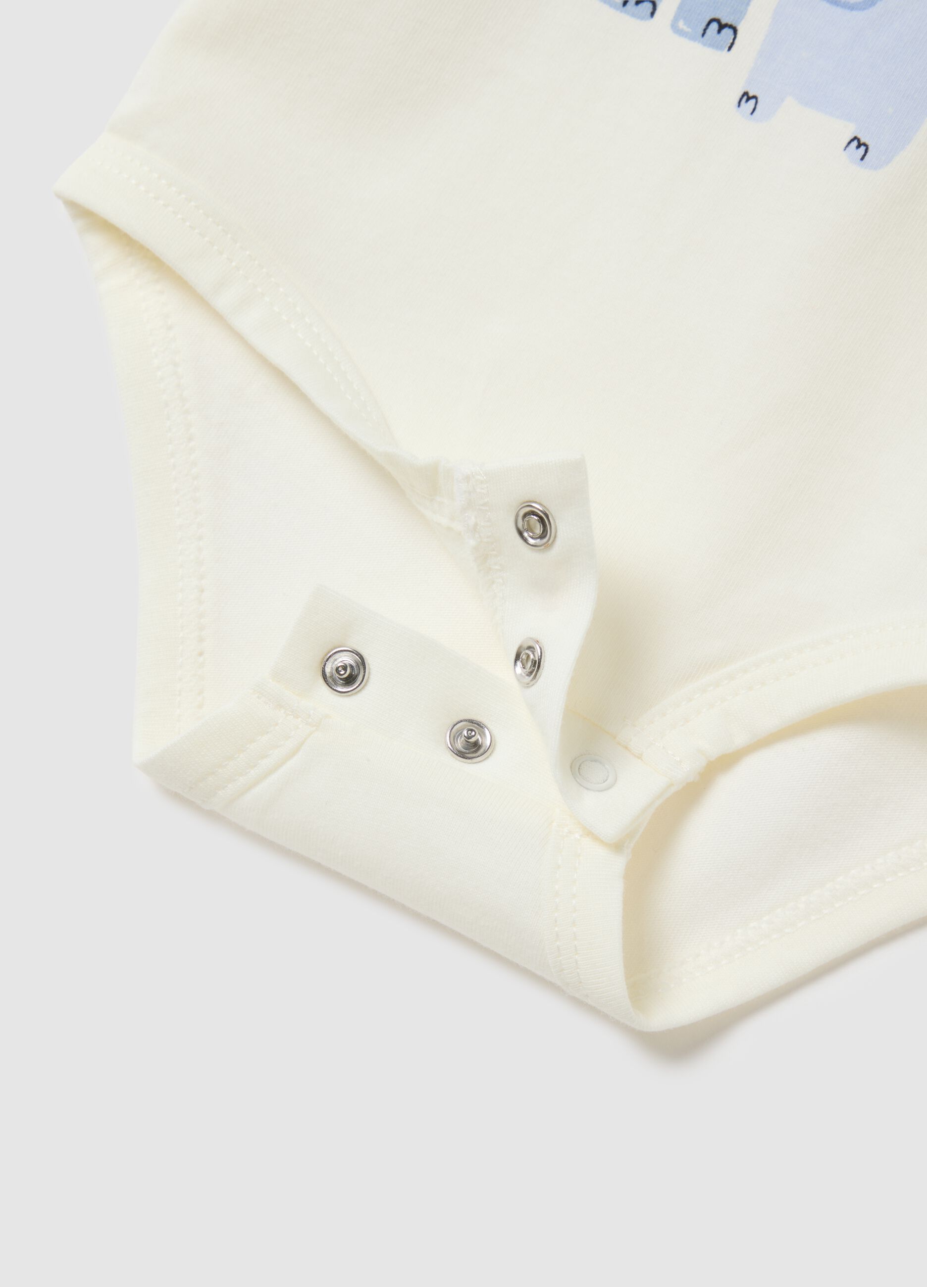 Baby bodysuit in pure white cotton with print