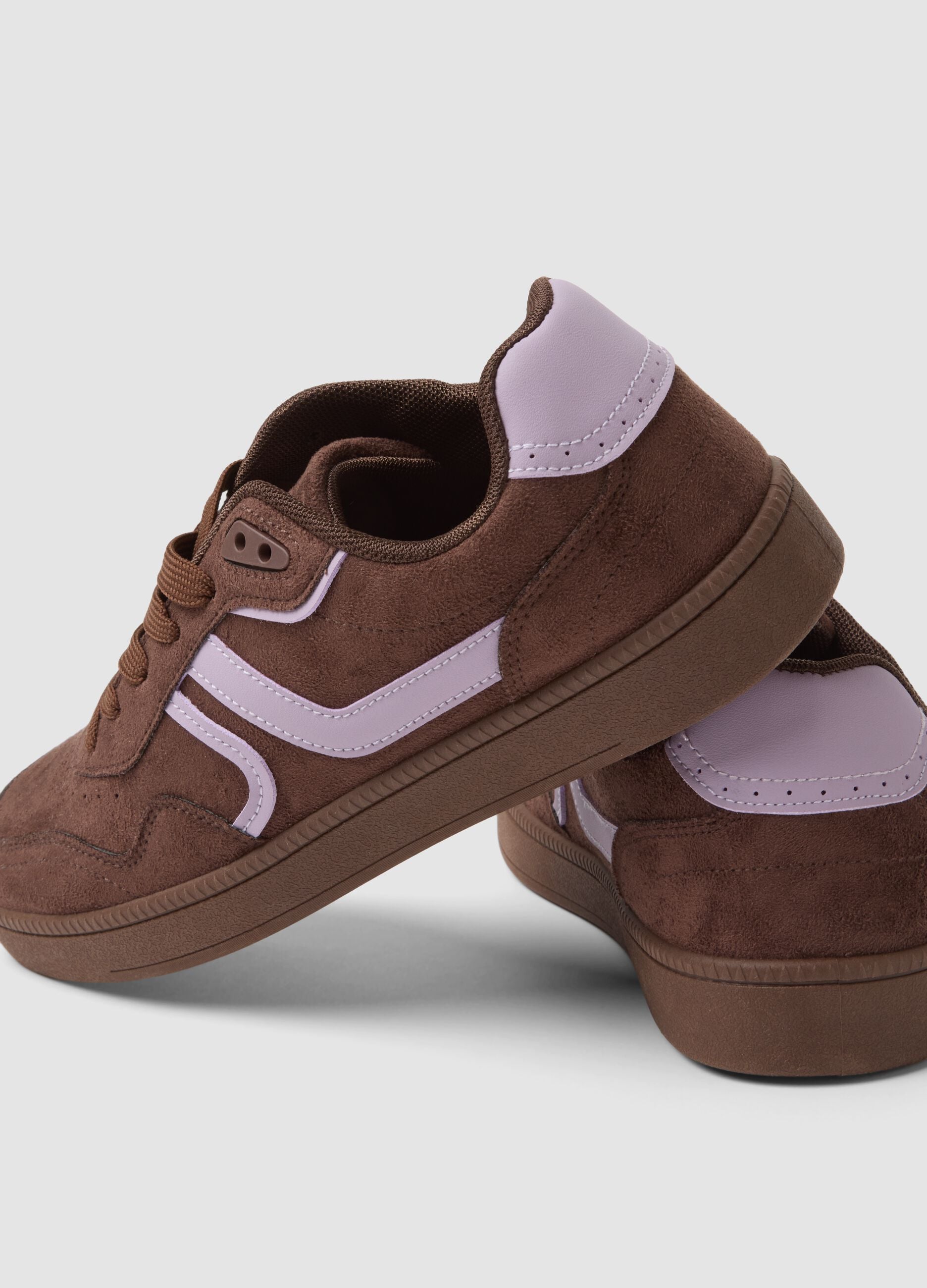 Brown trainers with pink inserts