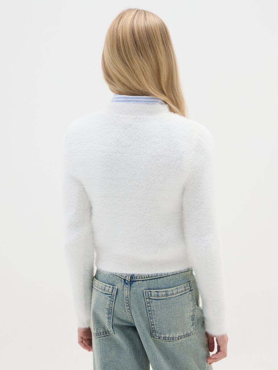 Girls' white sweater fitted with perforated heart_1