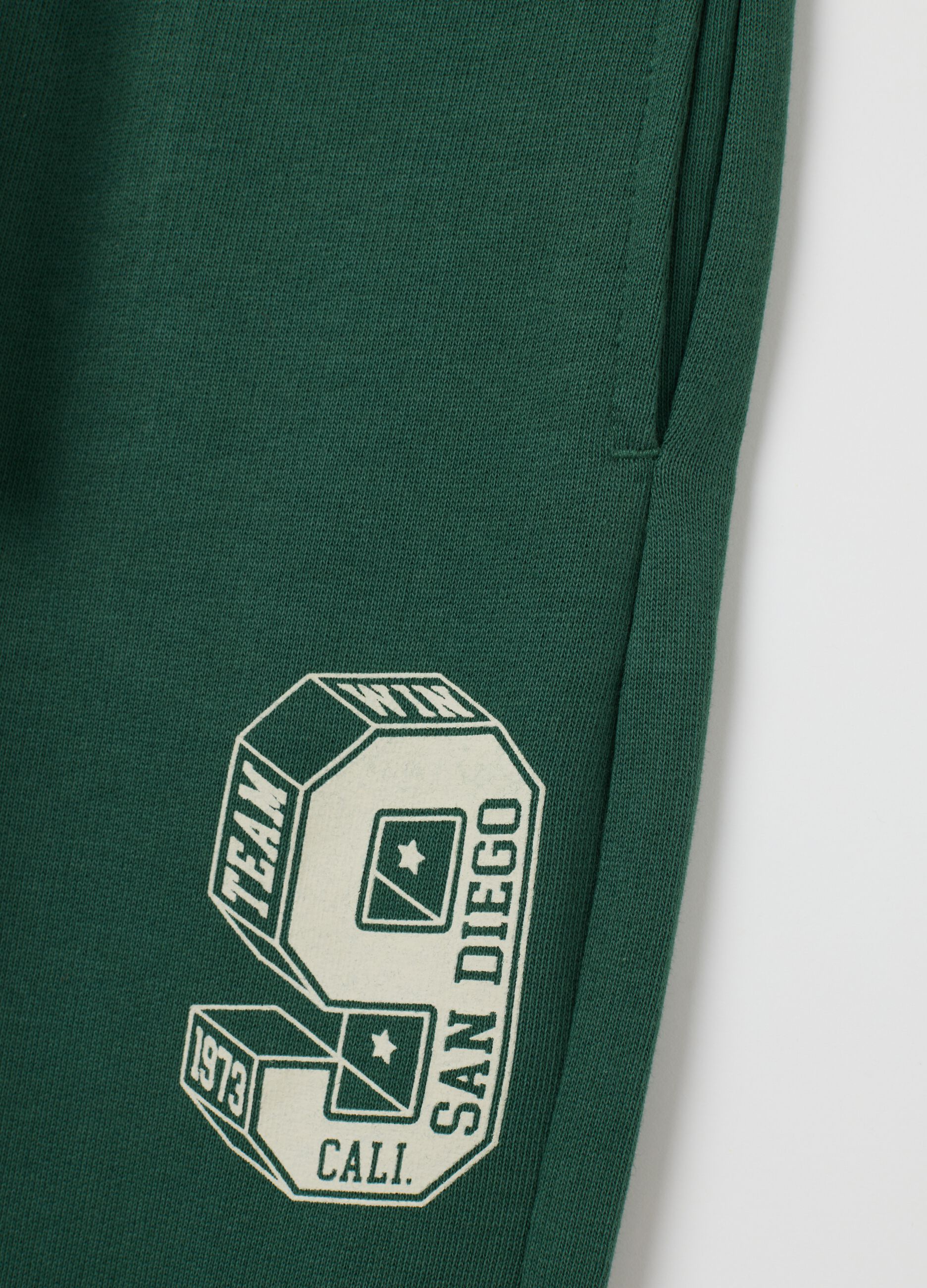 Children's green regular fit jogger trousers in pure cotton