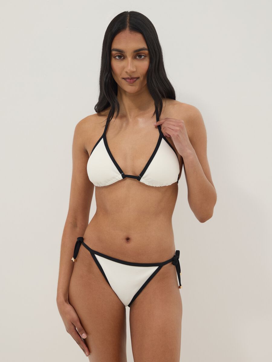 Slip bikini bianco e nero in tessuto elasticizzato con laccetti_0