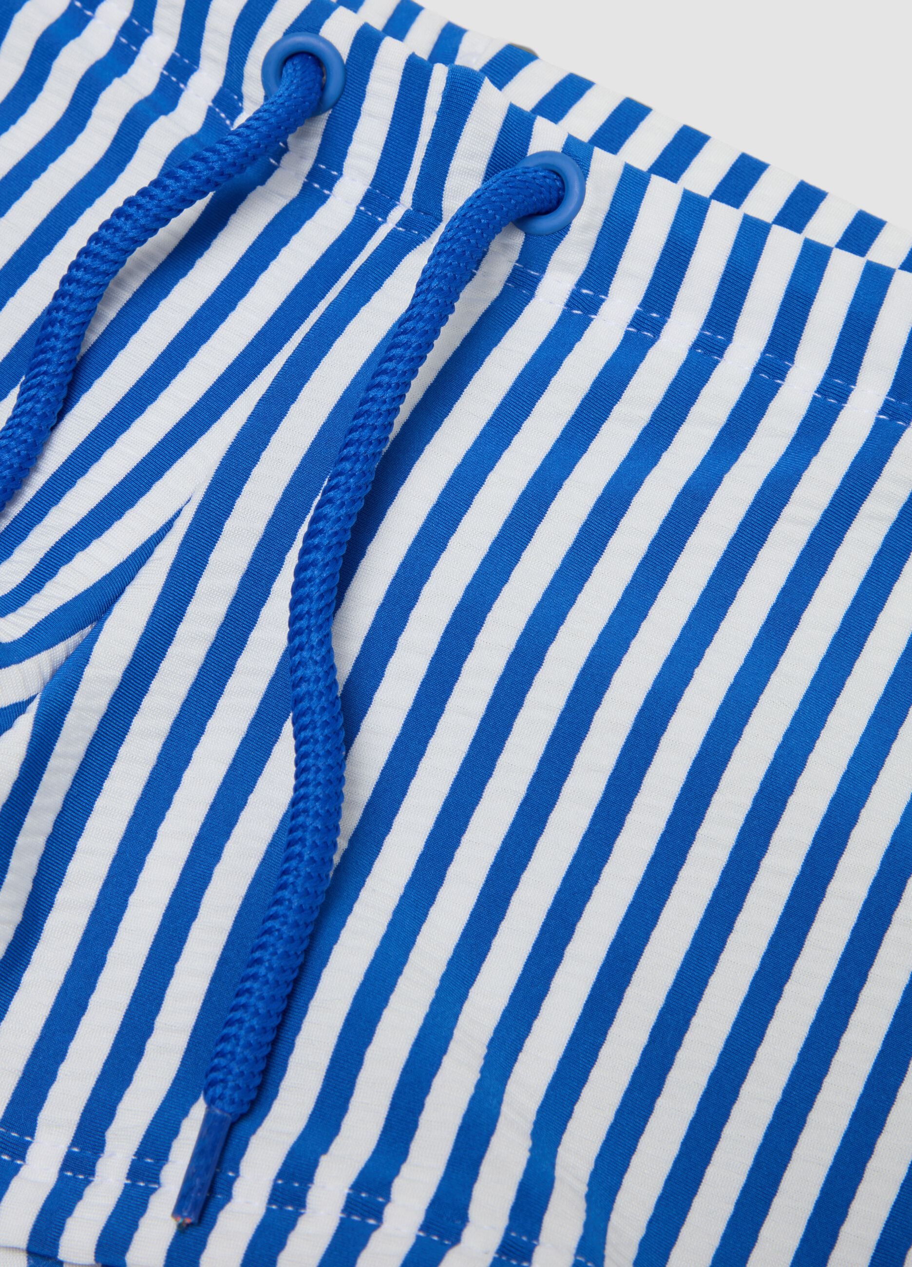 Blue and white stretch swim trunks
