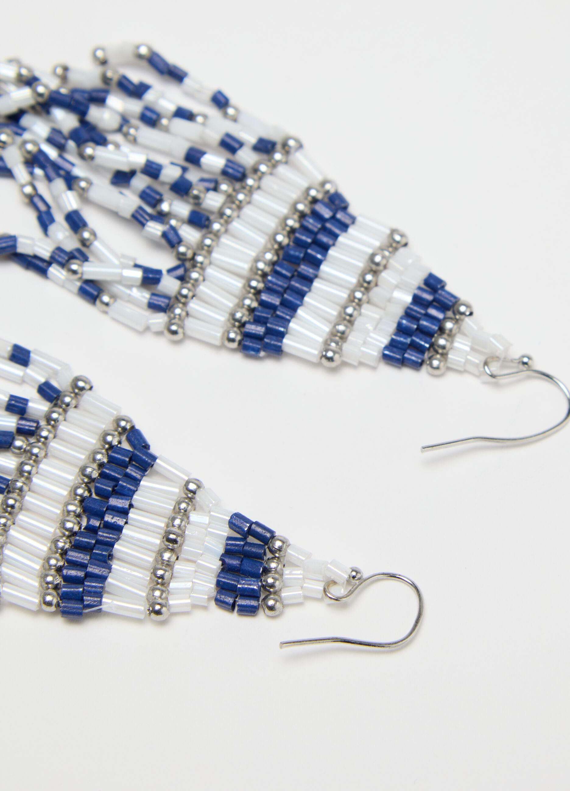 White and blue earrings with fringing
